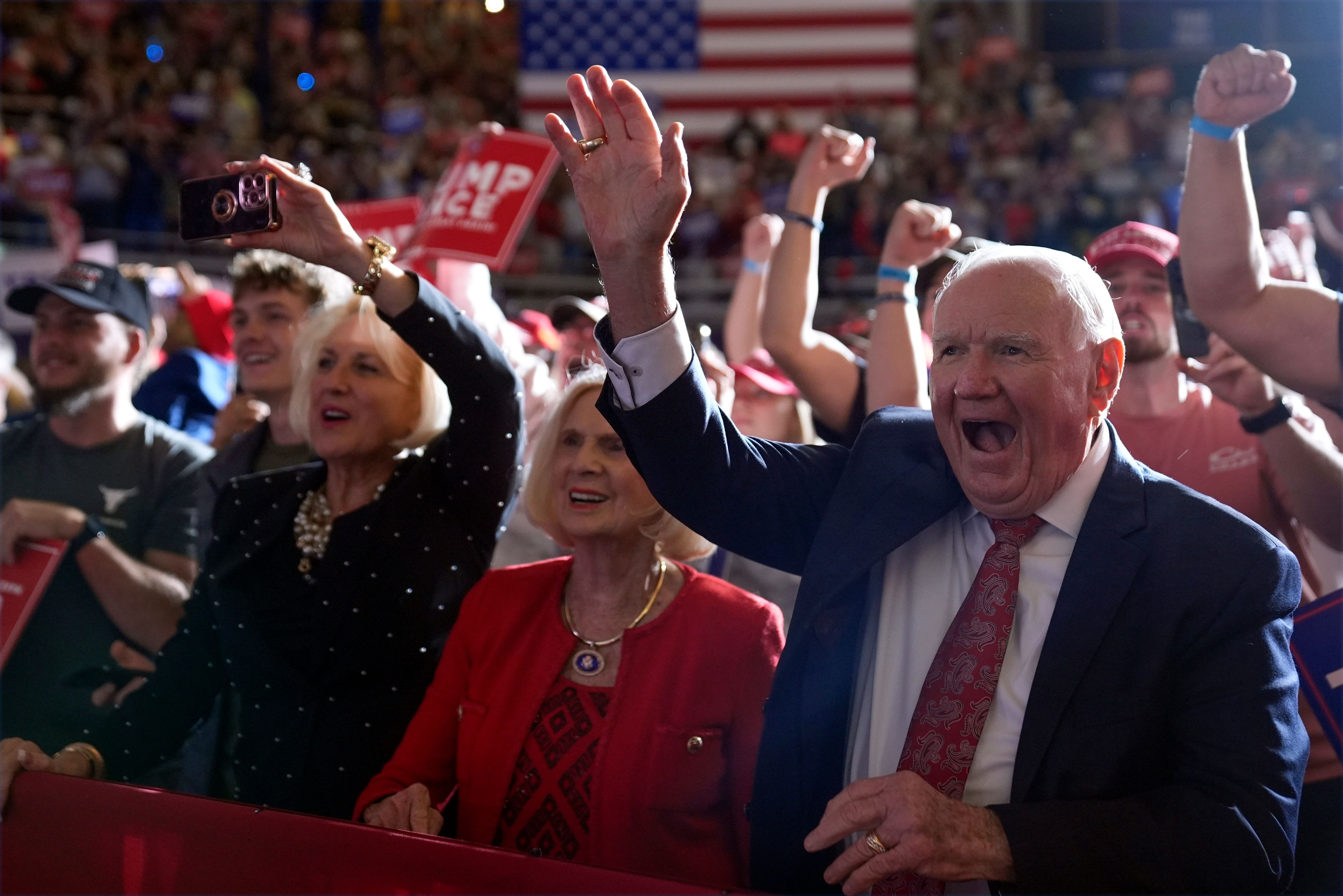 Supporters cheer as Republican presidential nominee former President Donald Trump speaks at a campaign rally at Williams Arena at Mignes Coliseum, Monday, Oct. 21, 2024, in Greenville, N.C. (AP Photo/Evan Vucci)