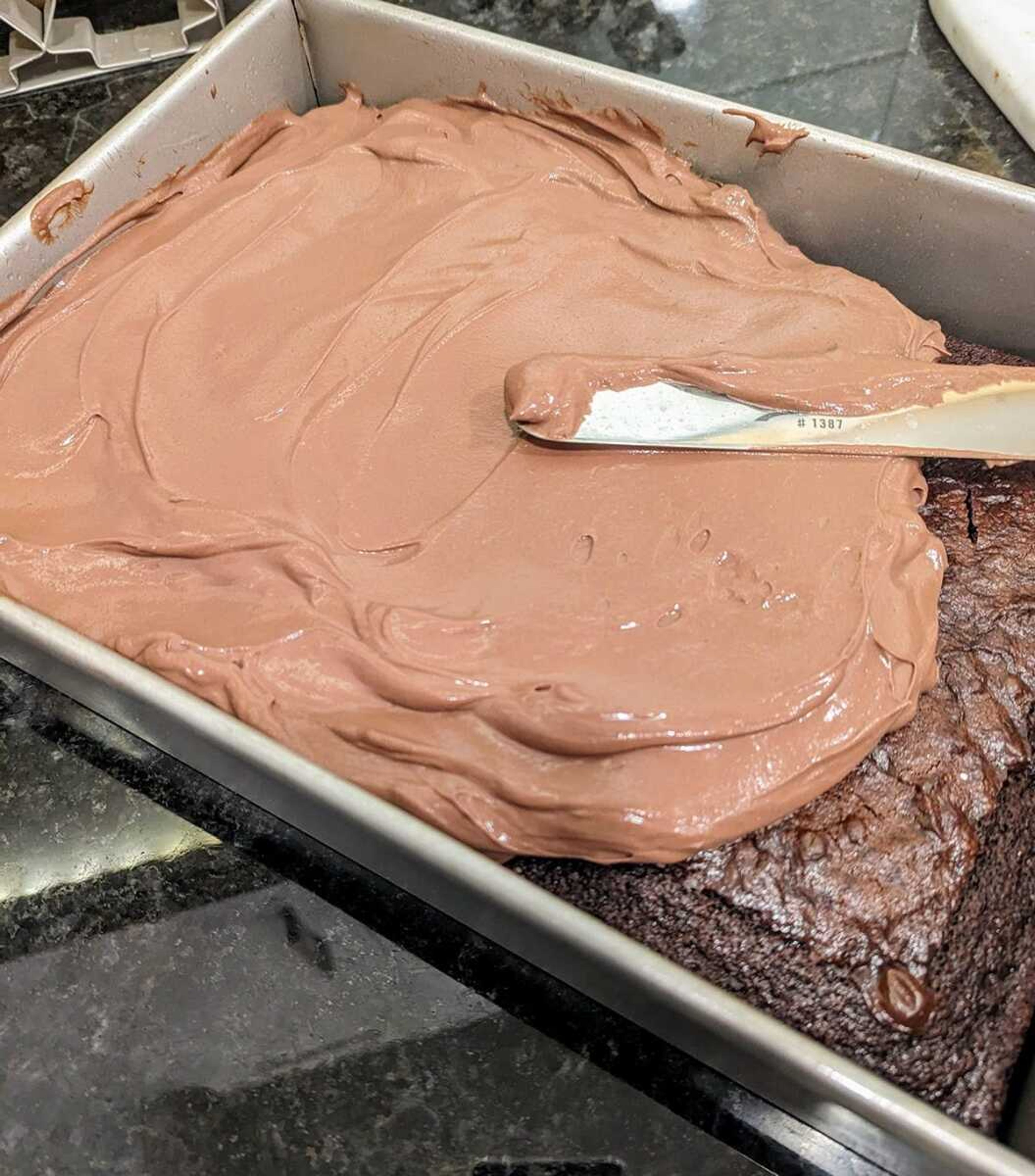 Chocolate sheet cake gets a coat of chocolate namelaka, a pastry cream as easy to make as it is luxurious.