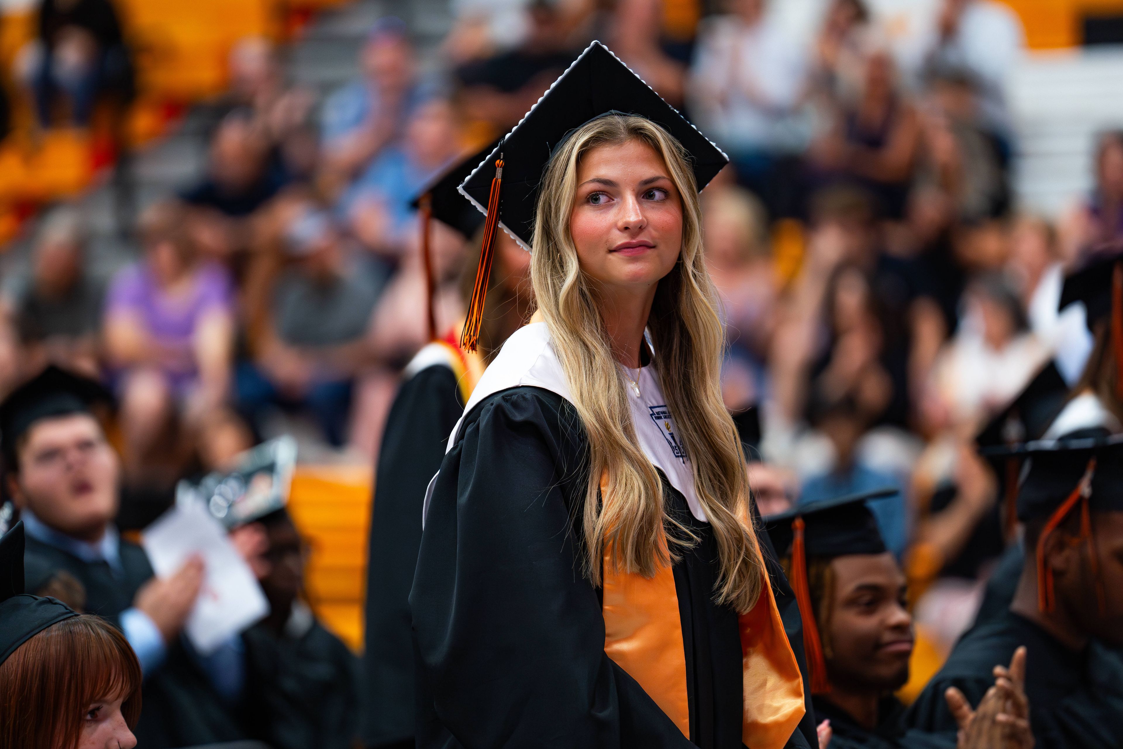 Brennan Beard stands among some of her fellow students as she and other students are acknowledged for their achievements on Thursday, June 13.