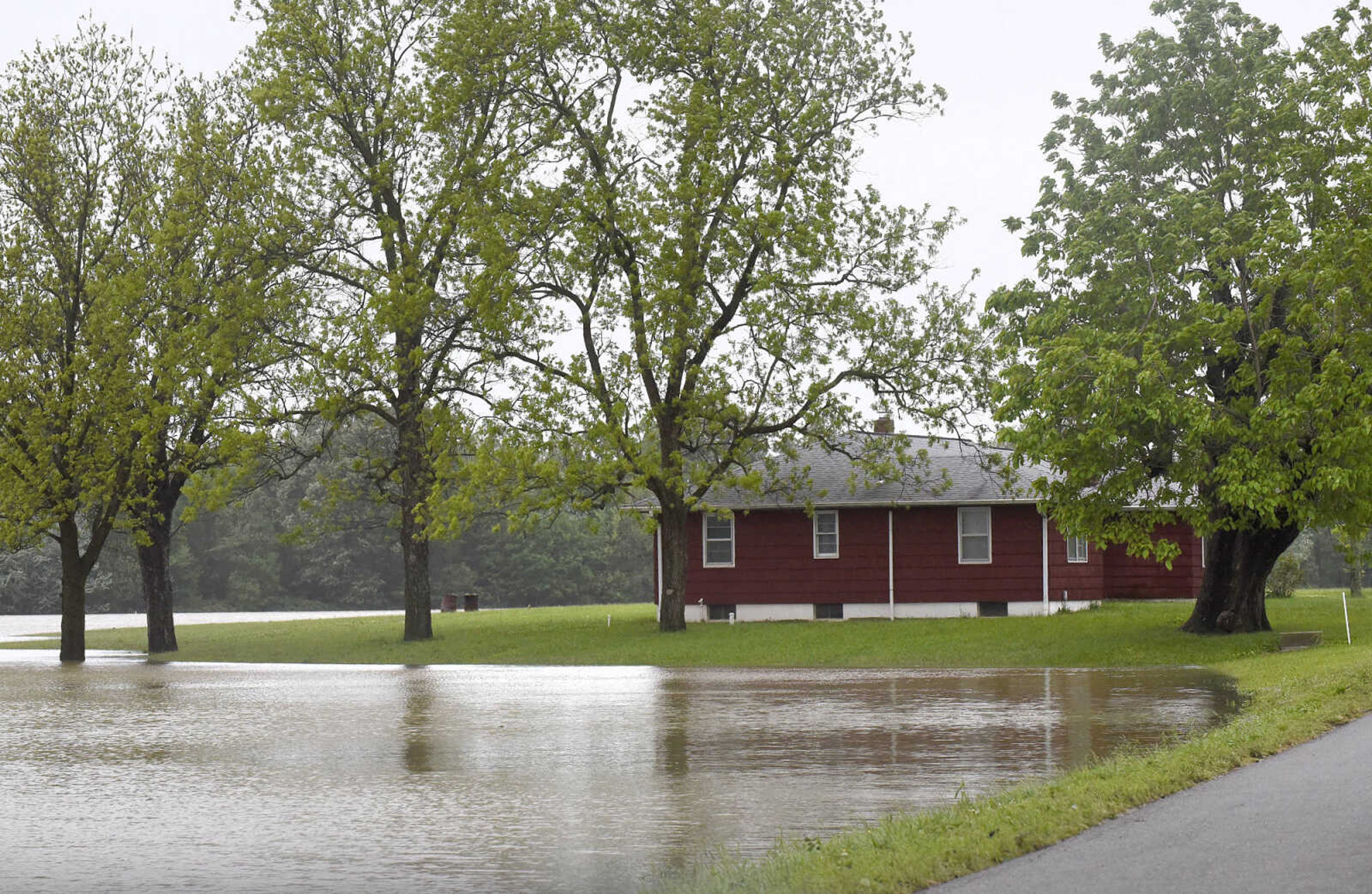 Floodwater creeps closer to homes along Cape Girardeau County Road 238 on Thursday, May 4, 2017, in Allenville, Missouri.