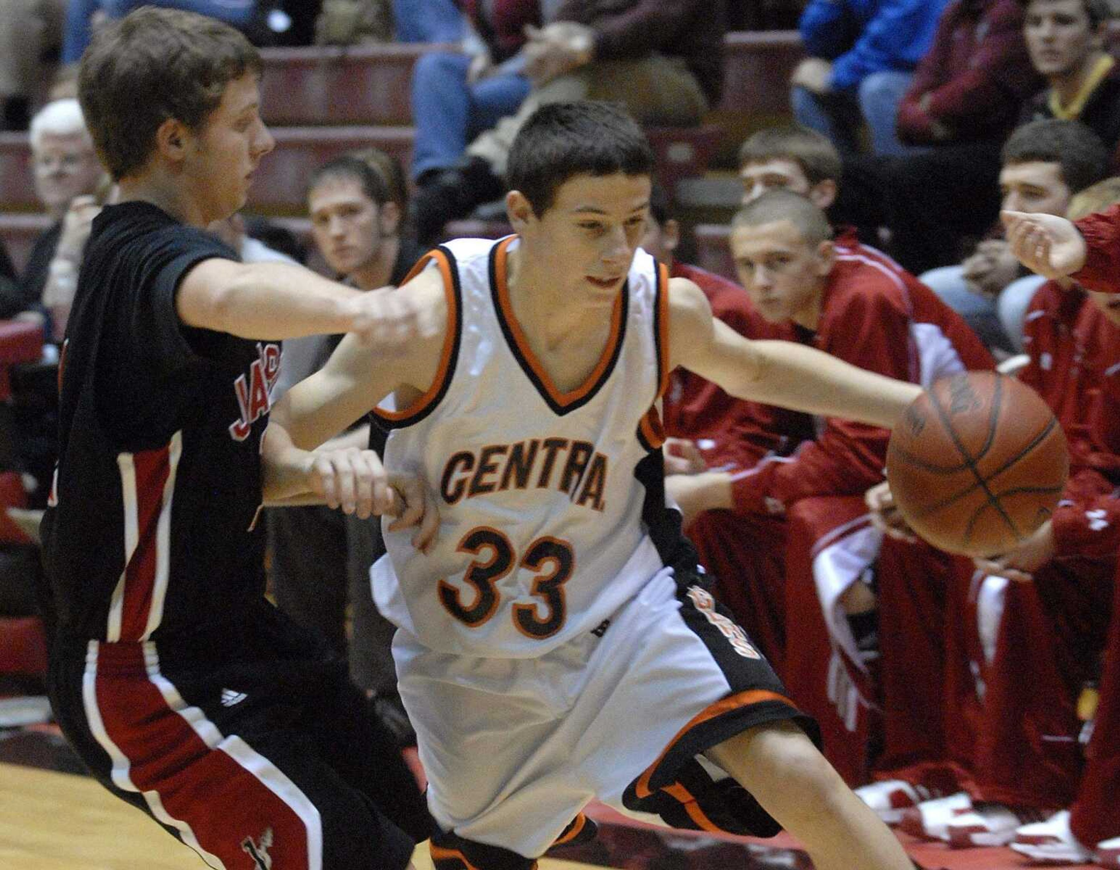 FRED LYNCH ~ flynch@semissourian.com
Central's Kevin Casasola drives against Jackson's Kyle Keith in the third quarter at the SEMO Conference tournament in Sikeston.