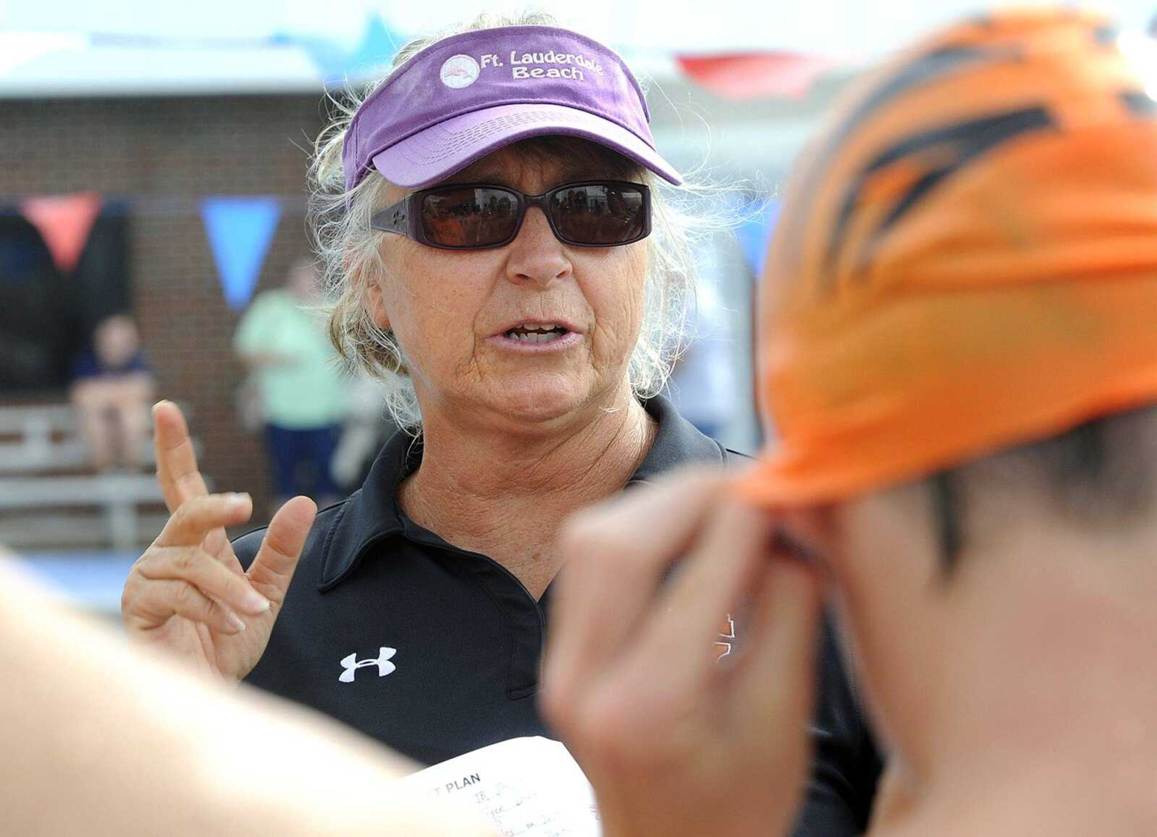 Cape Girardeau Central coach Dayna Powell instructs her team prior to Tuesday's  meet.