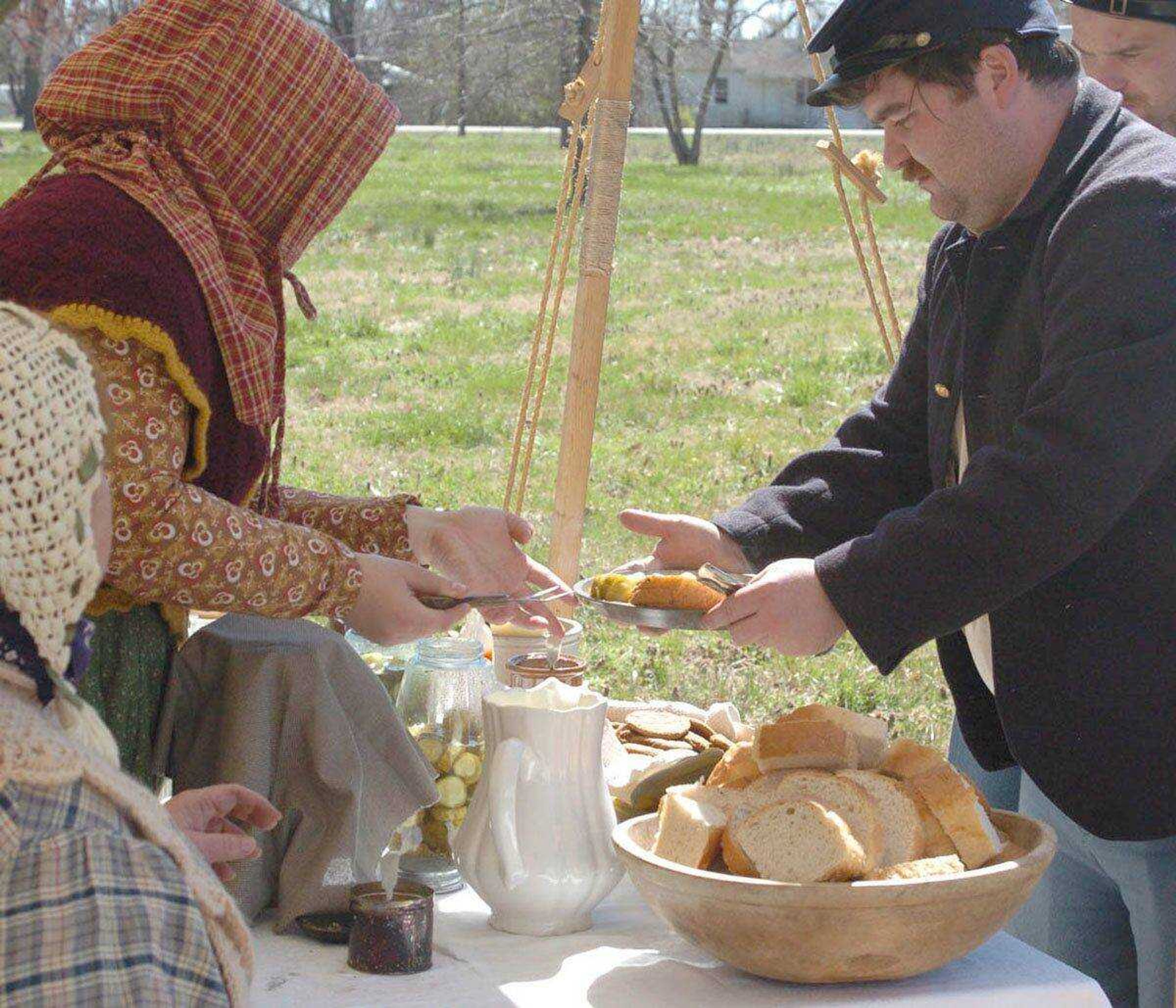 Becky LeBarre serves soldiers at last weekend's "Siege of New Madrid." (Jill Bock ~ jillb@standard-democrat.com)