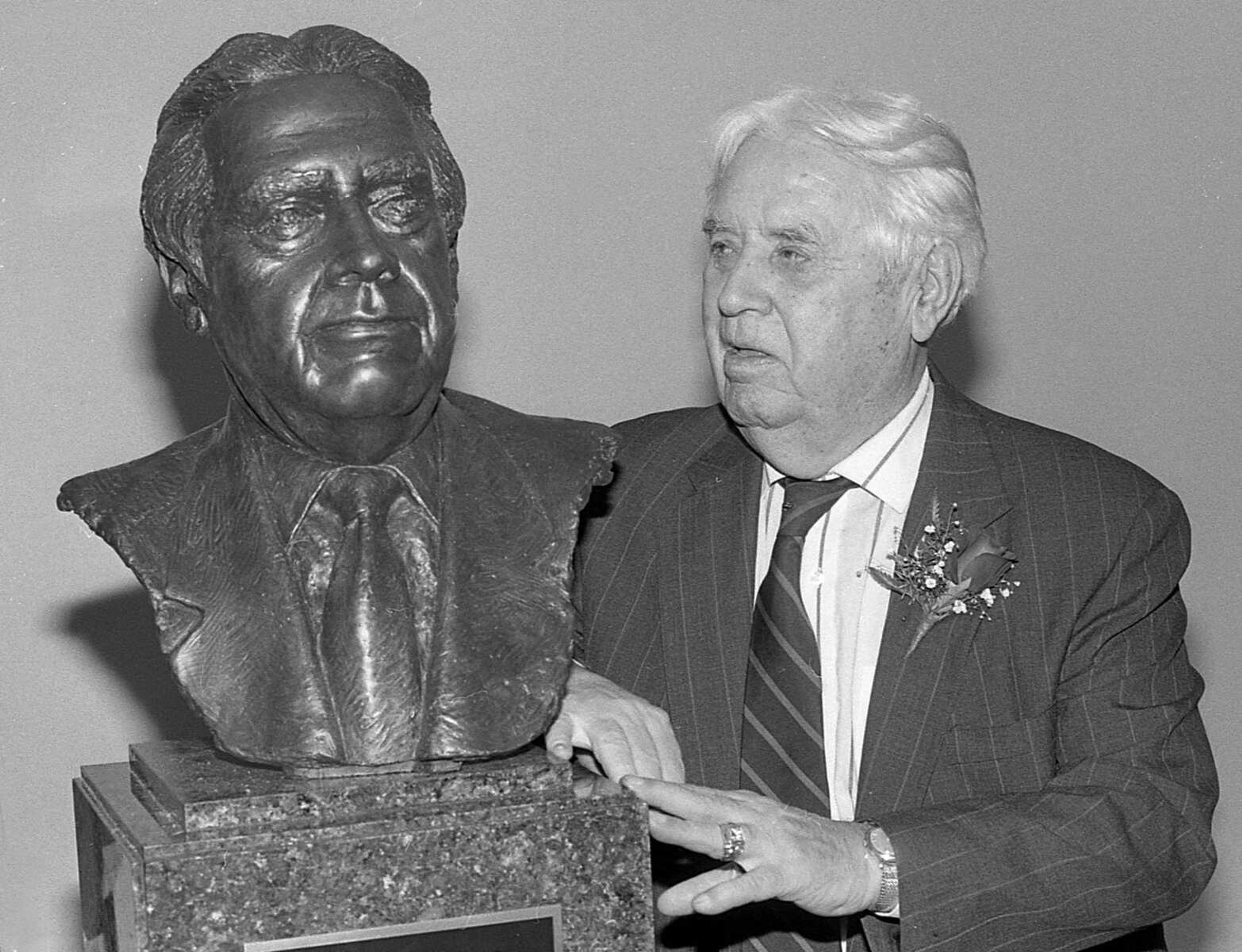 Published Feb. 12, 1993.
Retired Sen. John Dennis stands next to a portrait sculpture of himself Thursday night during a dinner in his honor at the Show Me Center in Cape Girardeau. (Don Shrubshell ~ Southeast Missourian archive)