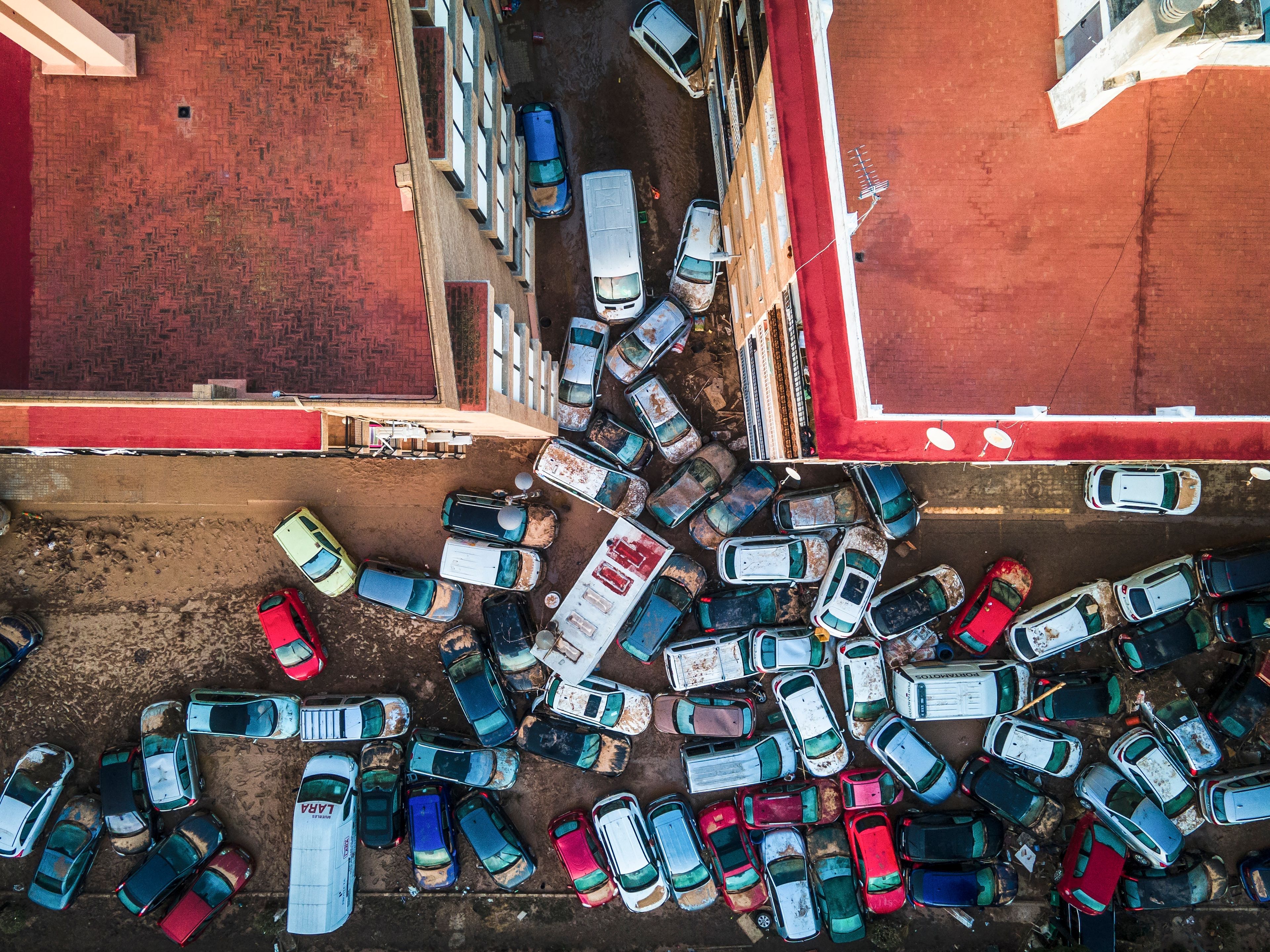 Vehicles pile up in the streets after flooding caused by late Tuesday and early Wednesday storm that left hundreds dead or missing in Alfafar, Valencia region, Spain, Saturday, Nov. 2, 2024. (AP Photo/Angel Garcia)