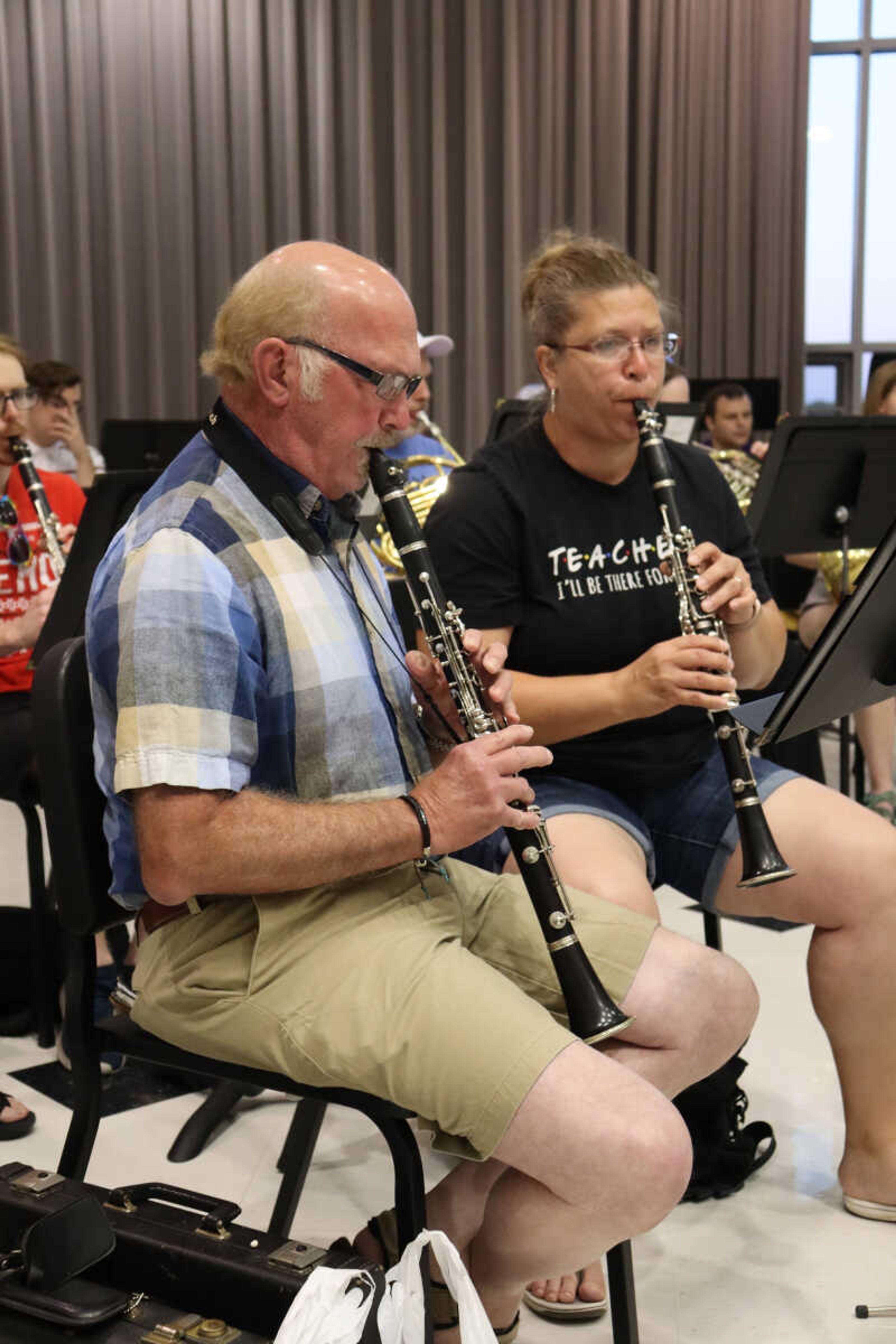 (Left) Clarinets Tony Nowell and Maria Mizicko following along with the director and the music at the Jackson Municipal Band practice.