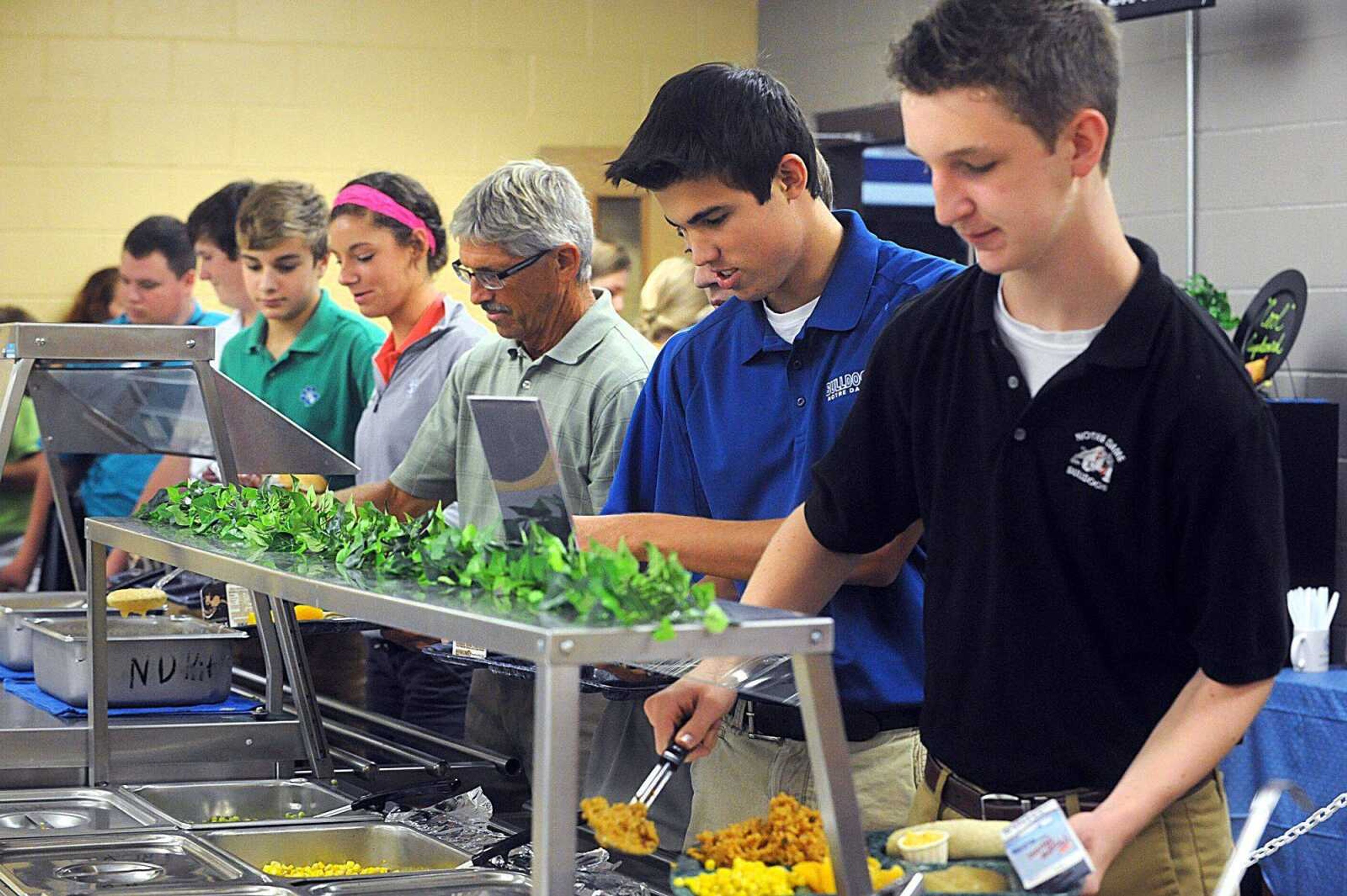 Students and faculty make their way through the lunch line at Notre Dame Regional High School. (Laura Simon)