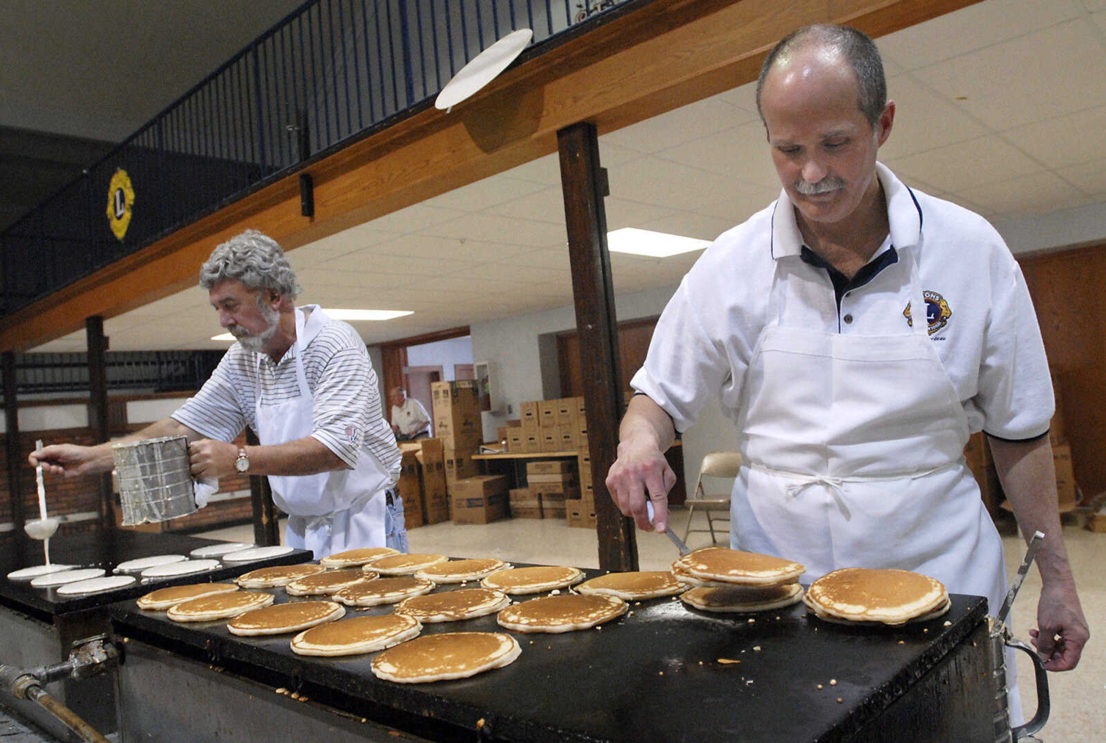 KRISTIN EBERTS ~ keberts@semissourian.com

Luke Landgraf, right, and Mike Kohlfeld, left, man the griddles during the 73rd annual Pancake Day put on by the Cape Lions Club at the A.C. Brase Arena on Wednesday, March 23, 2011, in Cape Girardeau. More than 10,000 pancakes and 700 pounds of sausage were served.