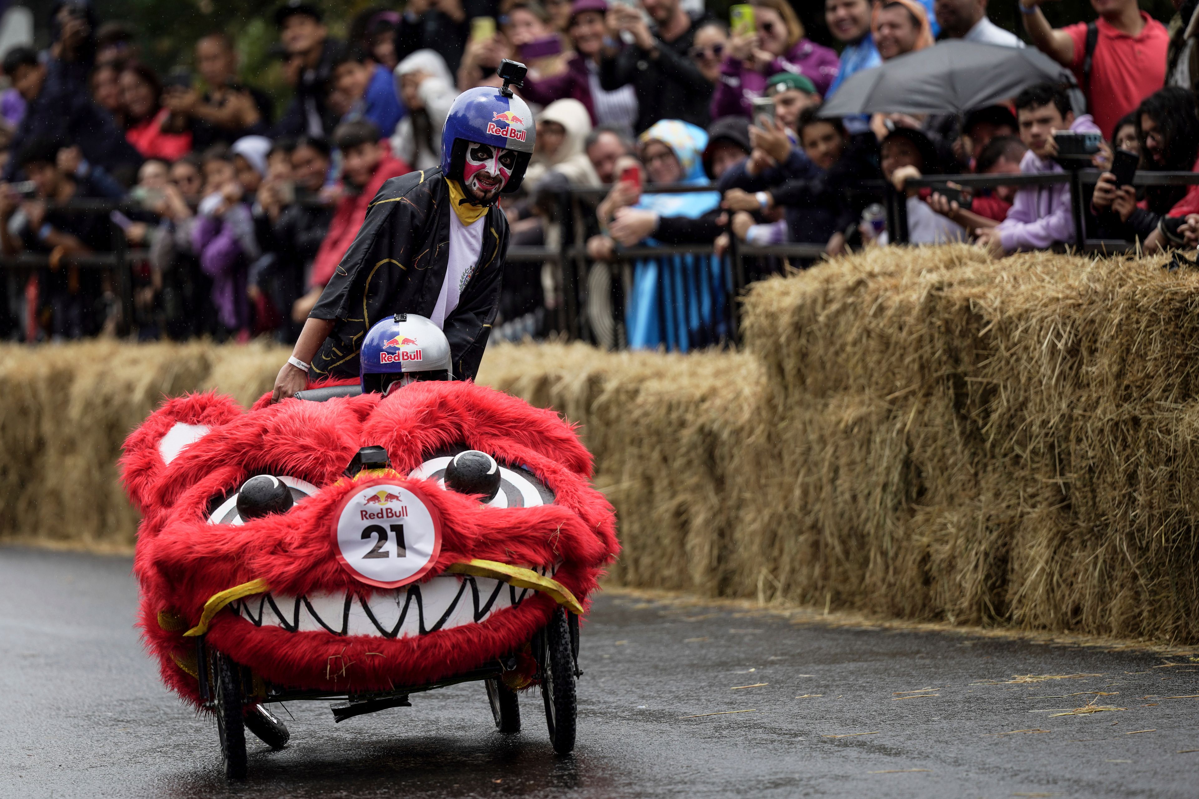 Participants complete a homemade gravity-powered vehicles race in Bogota, Colombia, Sunday, Sept. 29, 2024. (AP Photo/Ivan Valencia)