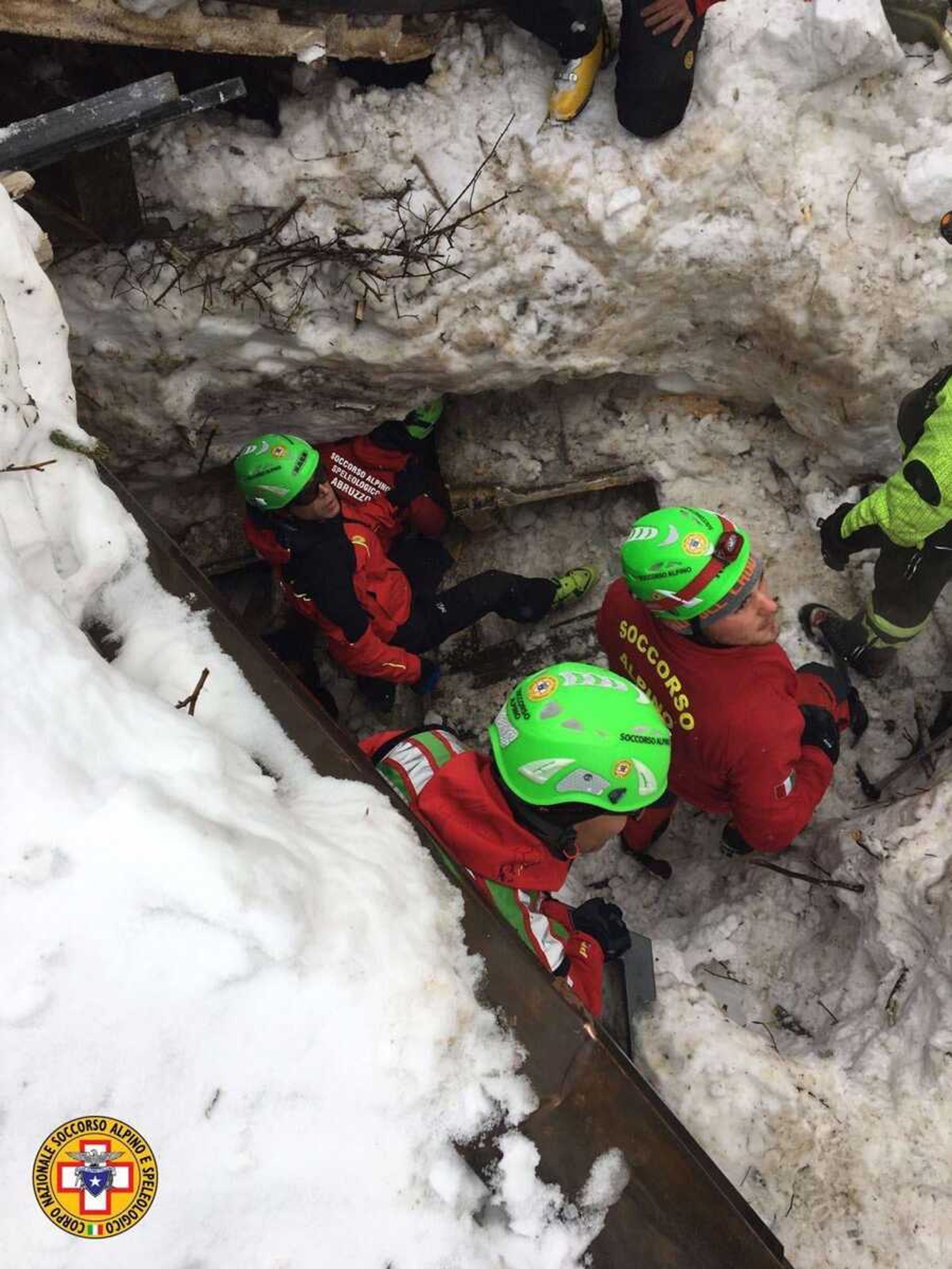 Rescuers work in the area of the avalanche-hit Hotel Rigopiano, central Italy, on Saturday. After two days huddled in freezing cold, tons of snow surrounding them in the wreckage of the avalanche-demolished hotel, survivors greeted their rescuers Friday as "angels."