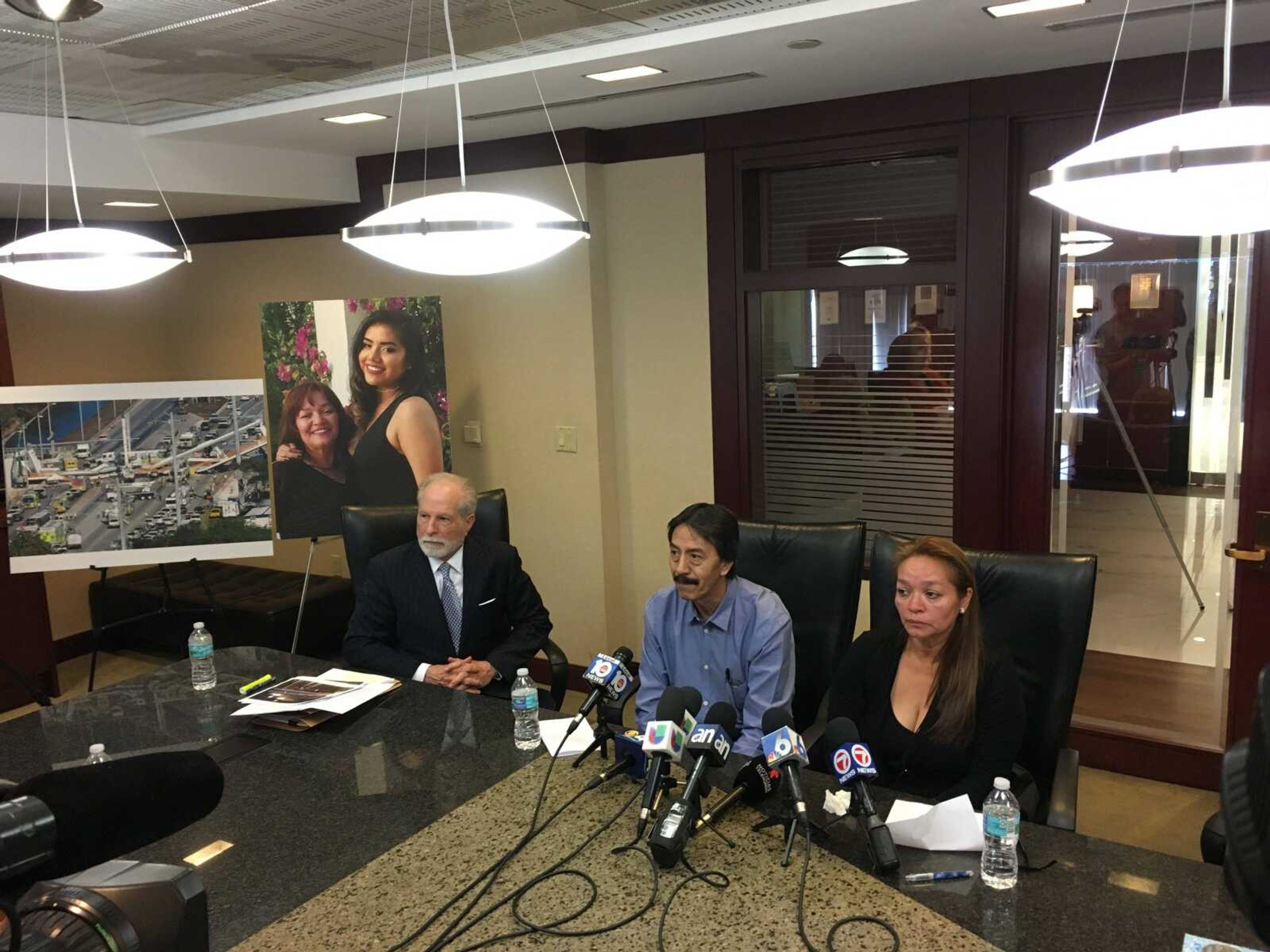 From left to right, attorney Alan Goldfarb and Orlando and Gina Duran speak to the media Tuesday in Miami about losing their 18-year-old daughter when a bridge collapsed and their legal fight against the companies in charge of the construction.