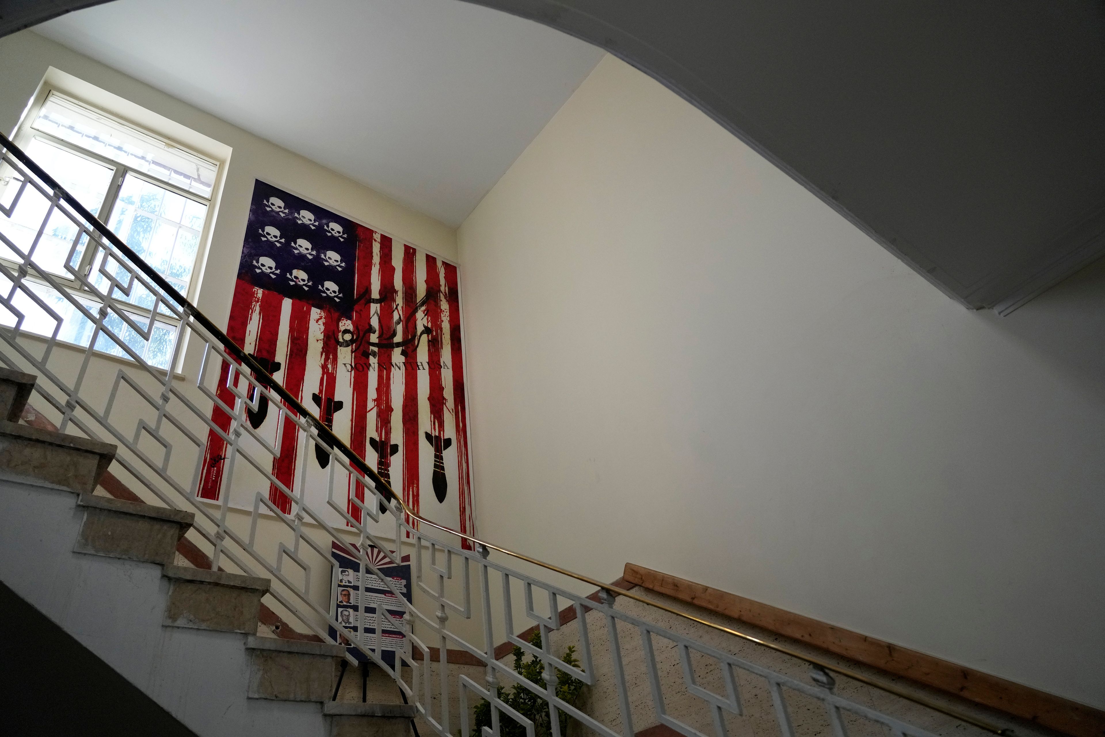 An anti-American poster is seen at the former U.S. Embassy, which has been turned into an anti-American museum, in Tehran, Iran, Tuesday, Oct. 22, 2024. (AP Photo/Vahid Salemi)