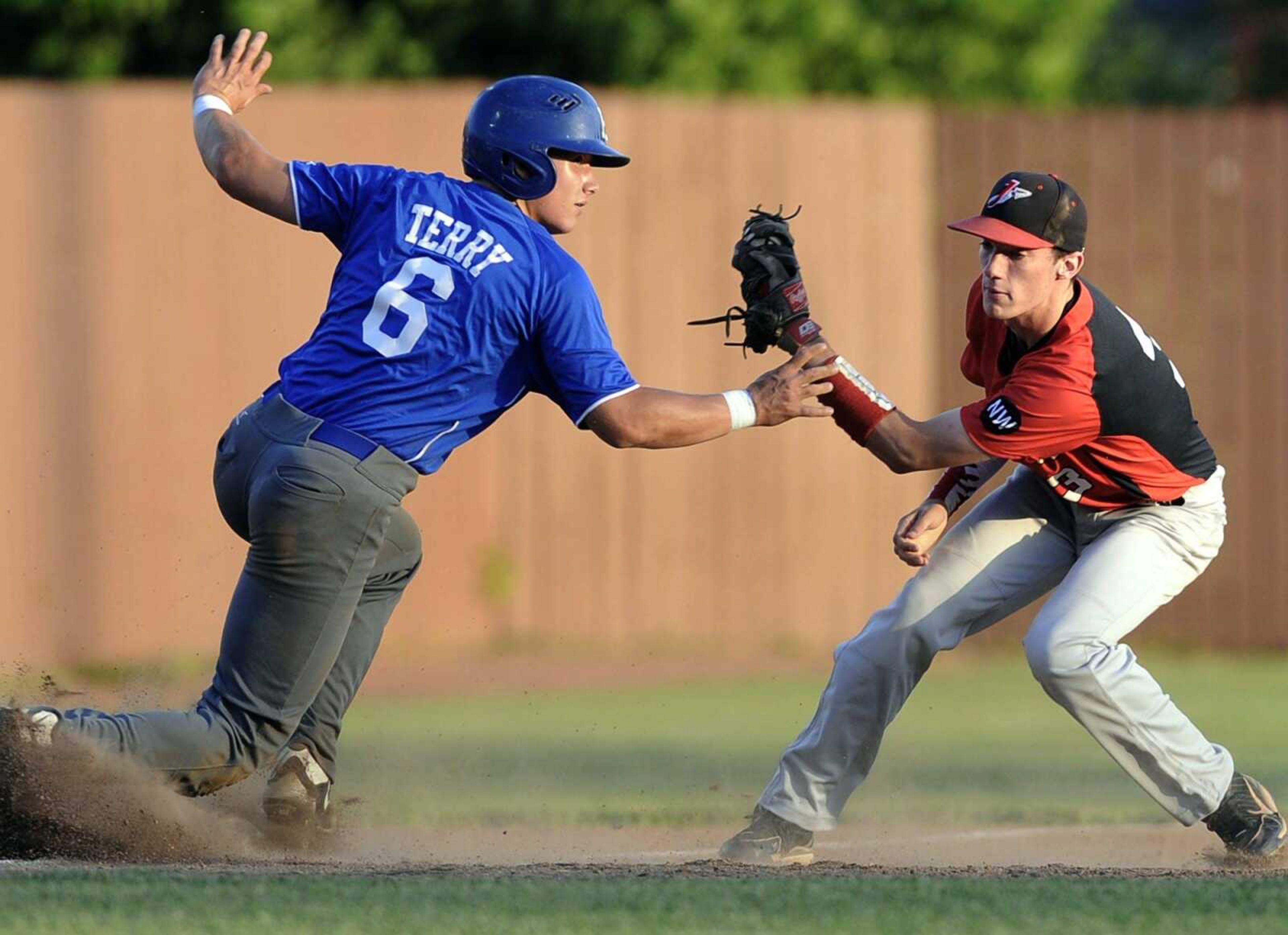 Jackson third baseman Cameron Duke tags out Hillsboro runner Trey Terry on a steal attempt during the second inning of a Class 5 District 1 quarterfinal Monday, May 18, 2015 in Farmington, Missouri. (Fred Lynch)