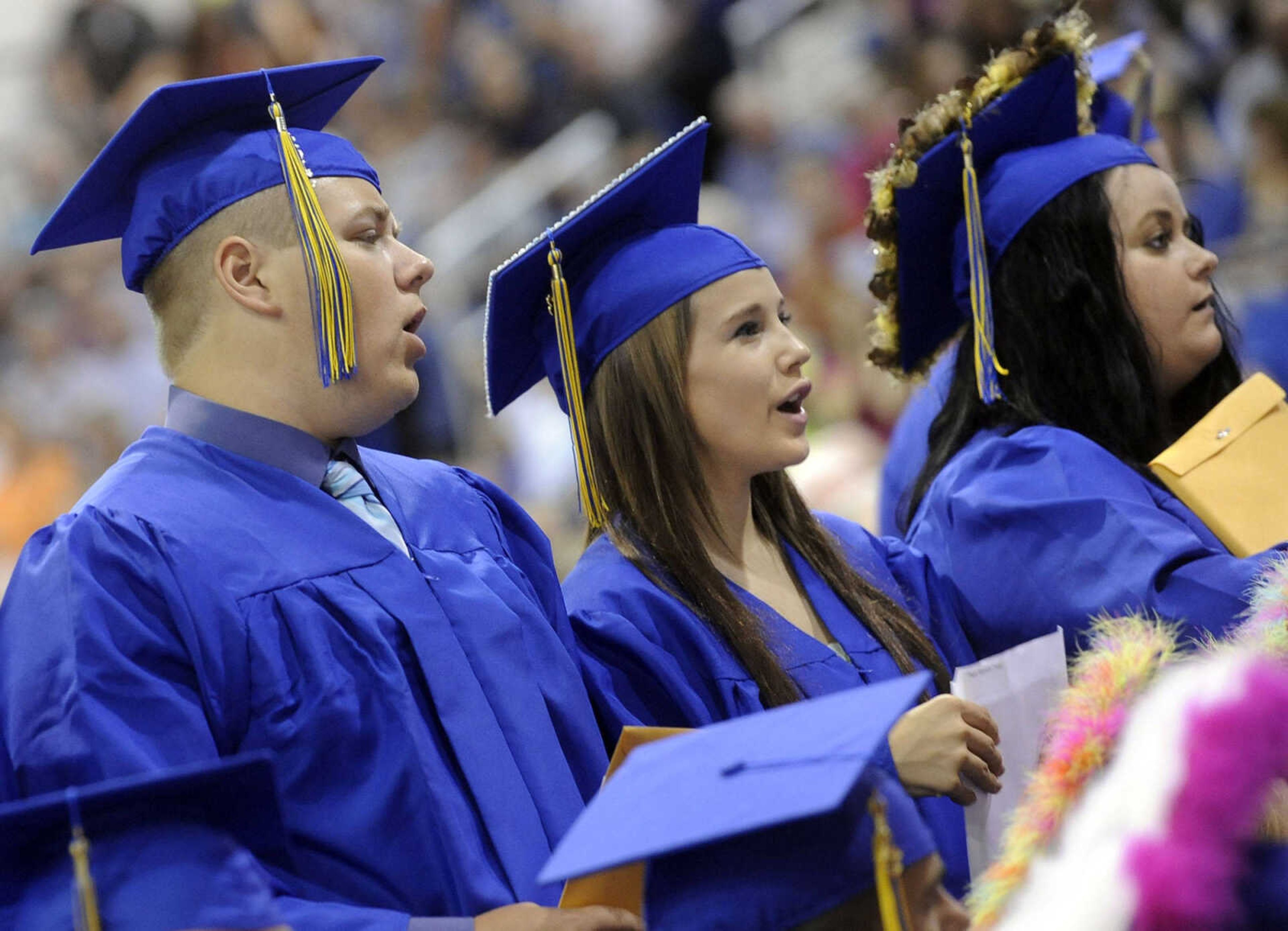 Scott City graduates stand with their diplomas.