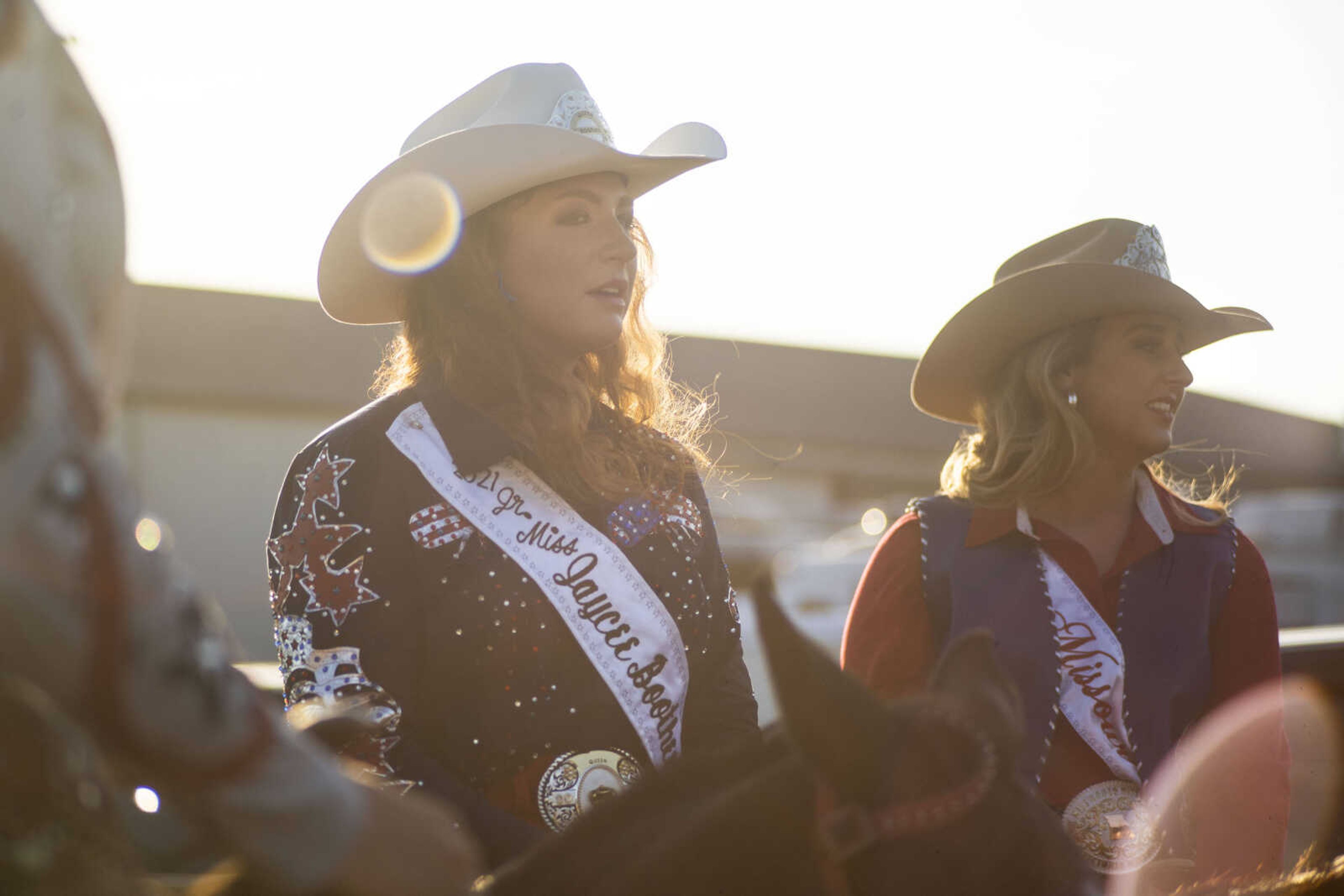 Jr. Ms Sikeston Rodeo Queen Kinleigh Chappell, center, is seen with other riders before the opening ceremonies of the Sikeston Jaycee Bootheel Rodeo on Wednesday, Aug. 11, 2021, in Sikeston, Missouri.