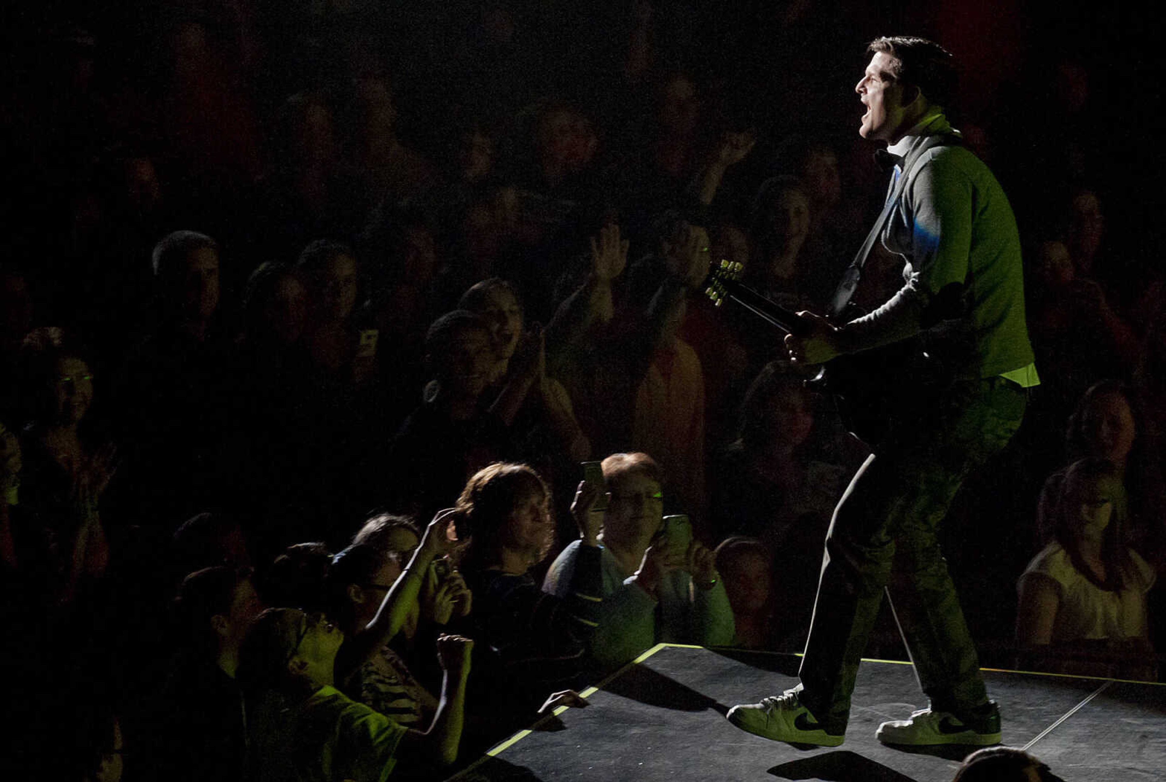 Tim Rosenau plays guitar as TobyMac performs as part of the Hits Deep Tour Friday, Dec. 13, at the Show Me Center in Cape Girardeau. The Christian rapper, whose given name is Toby McKeehan, has sold 11 million  albums and won six Grammy awards in his career.