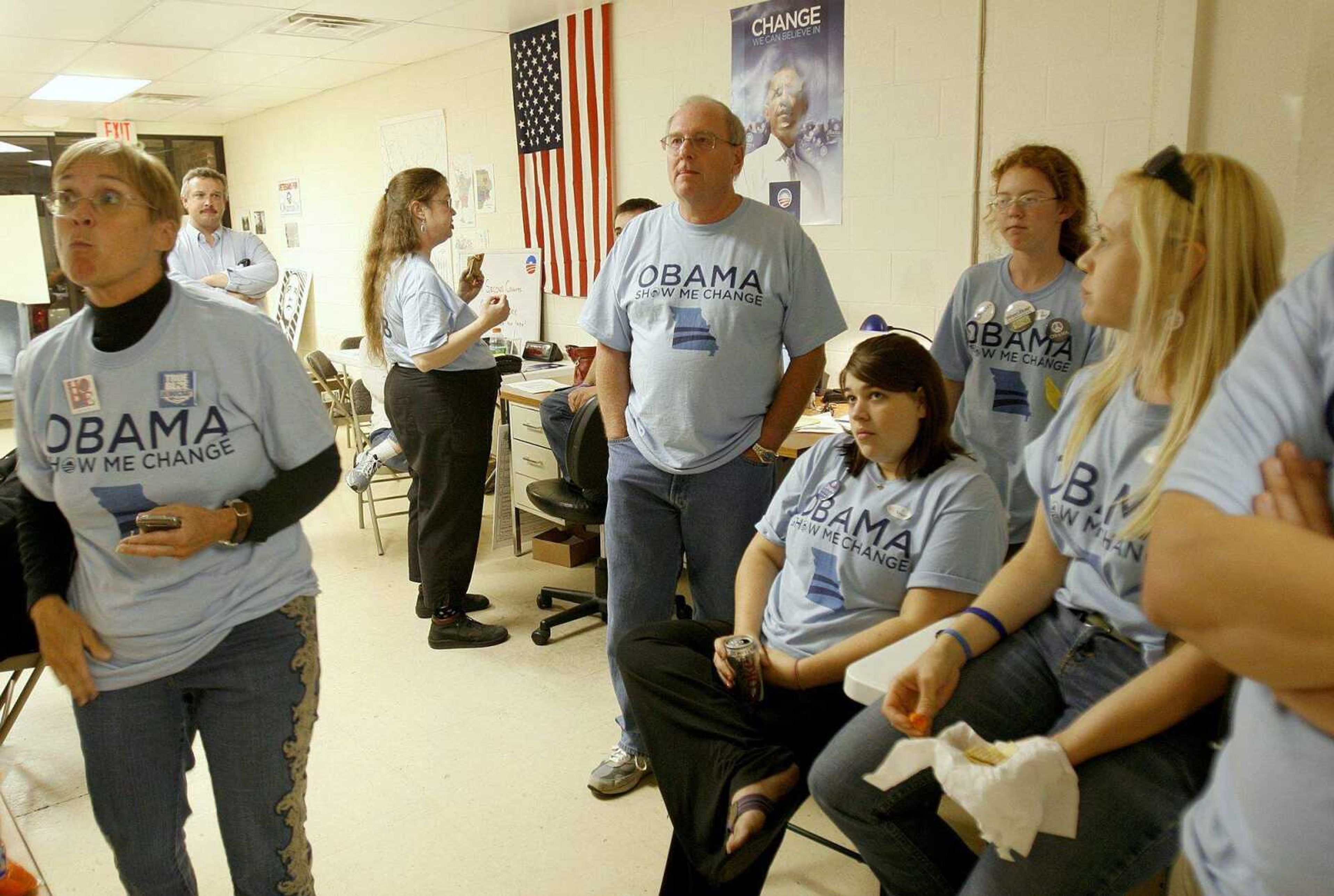 ELIZABETH DODD ~ edodd@semissourian.com
Volunteers at Obama headquarters crowd a small television for updates around 5:30p.m. Tuesday night.