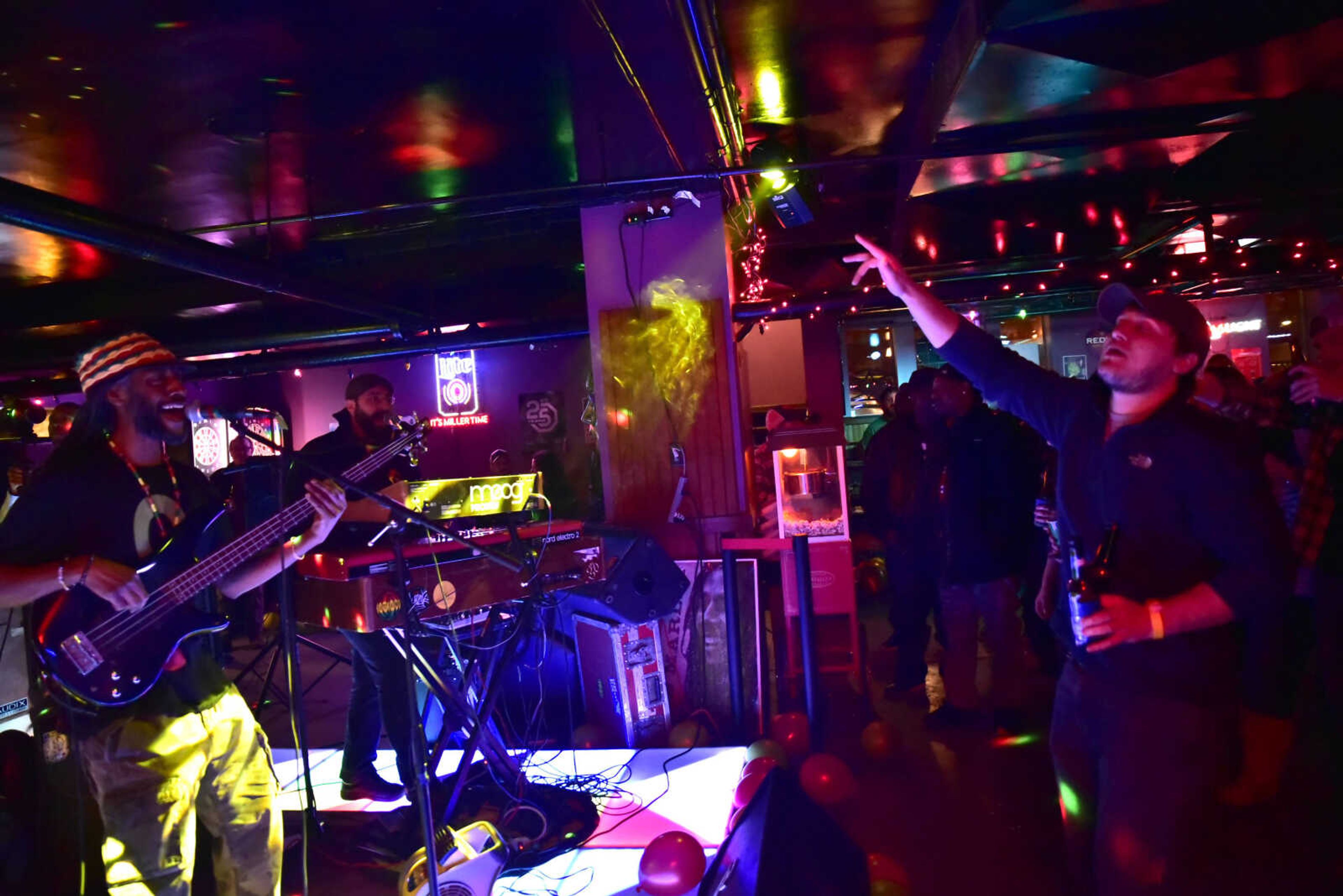 Joh Boogie of Natty Nation covers Bob Marley's "Everything's Gonna Be Alright" while a patron sings along at the 3rd annual Bob Marley Day celebration held at Ragsdales in downtown Cape Girardeau Feb. 10, 2018.