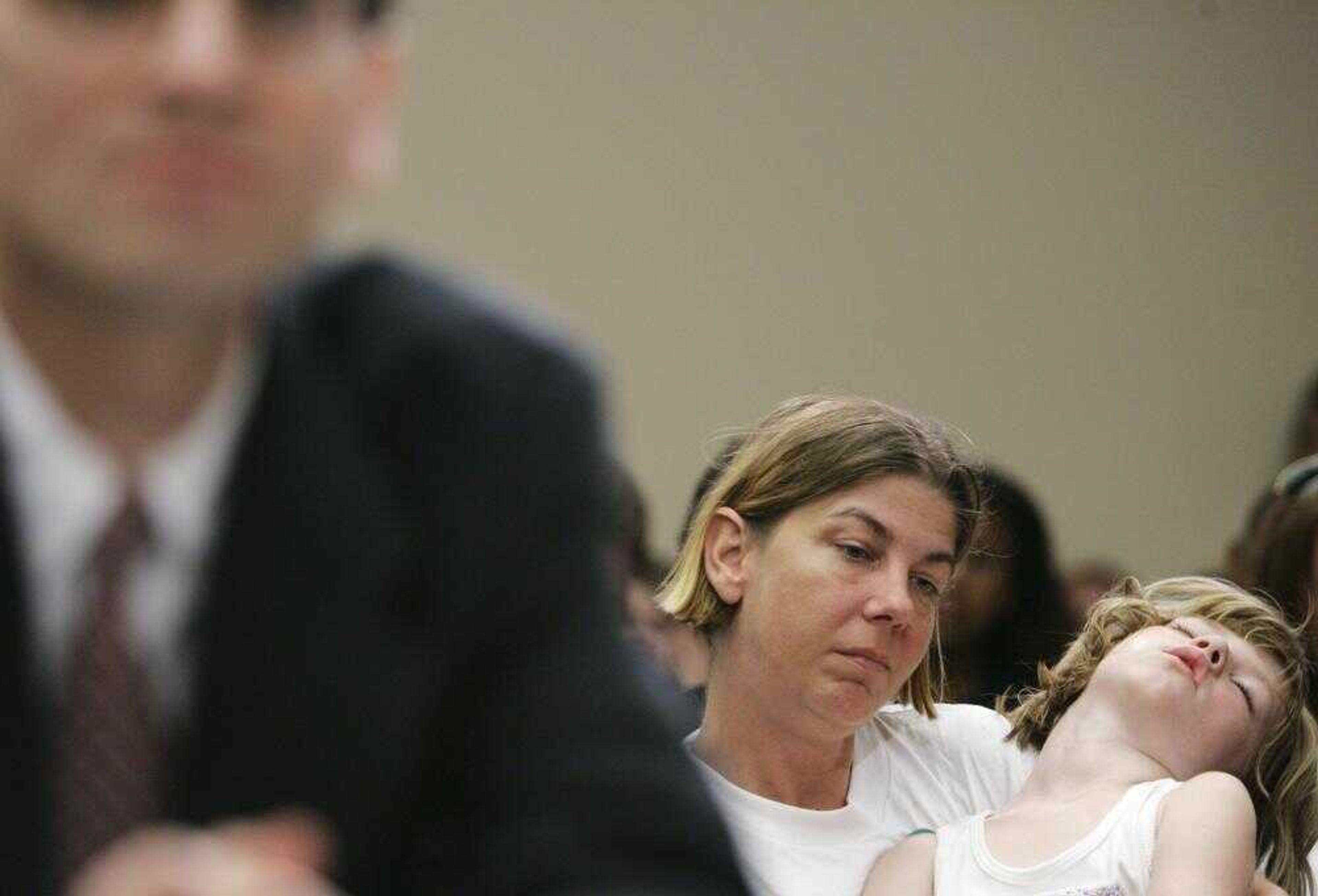 A child fell asleep in her mother's arms during Tuesday's testimony on Capitol Hill in Washington, D.C., before the House Constitution, Civil Rights, and Civil Liberties subcommittee oversight hearing on habeas corpus and detentions at Guantanamo Bay. (HARAZ N. GHANBARI ~ Associated Press)