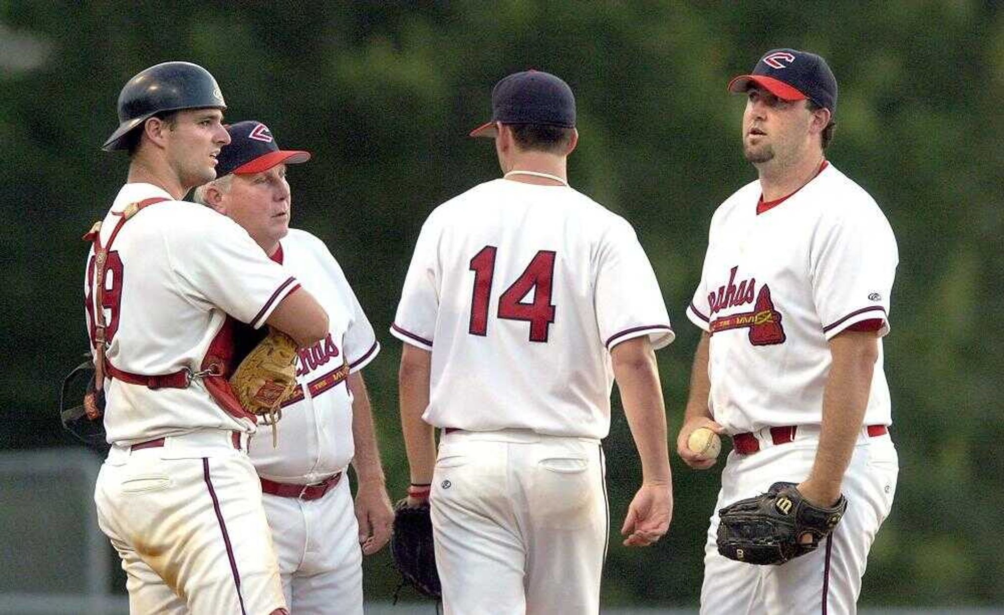 It was all for Capaha's starting pitcher Jason Chavez, center, as Coach Jess Bolen, left rear, called in Brian Ingram, right, to take over in the sixth inning of Saturday's, July 2, 2005, game with the Wichita Broncos at Capaha Field. Capahas' catcher Levi Olson, front left, looks on. (DON FRAZIER ? dfrazier@semissourian.com)