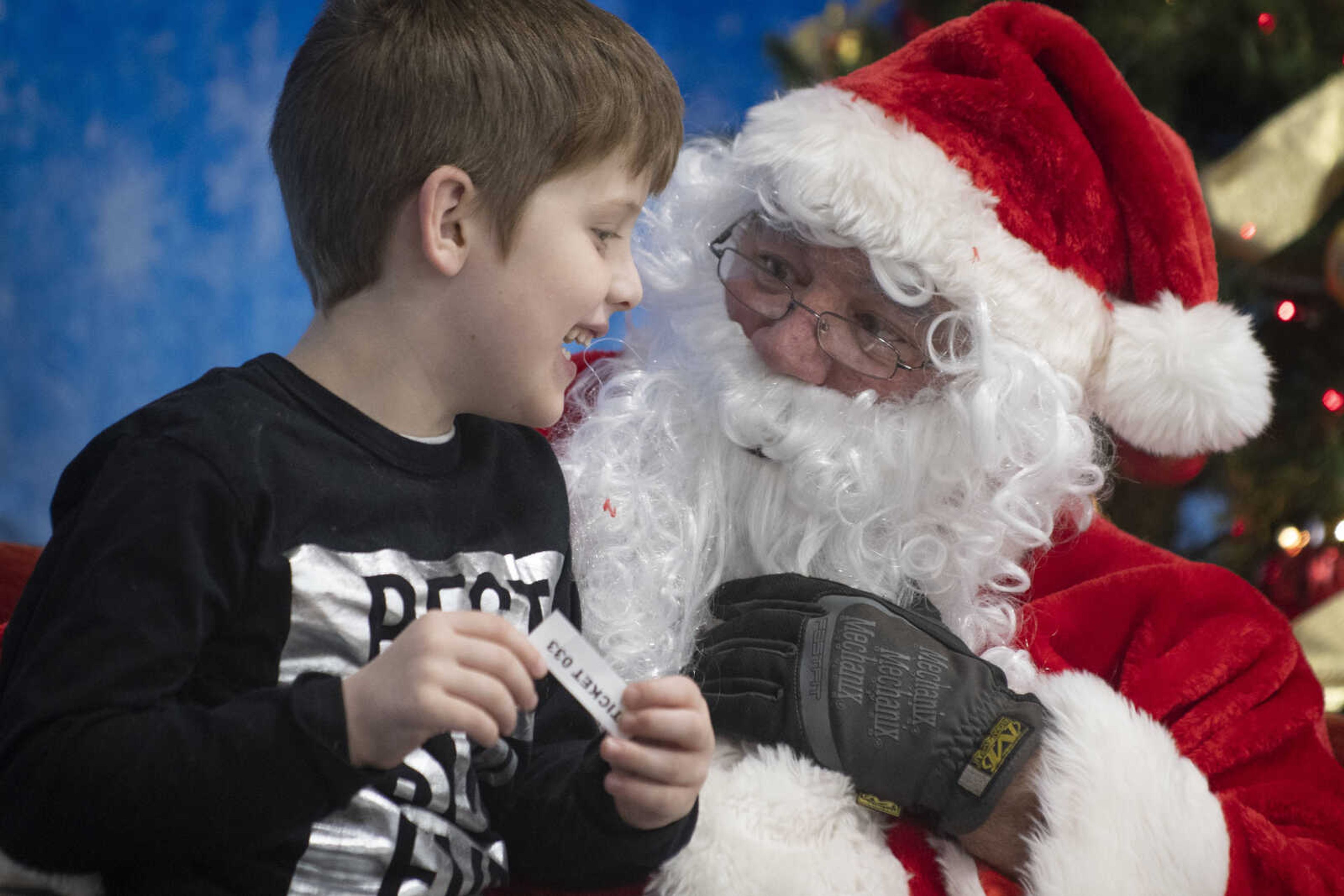 Jude Thiele, 5, of Jackson meets with Santa Claus, portrayed by City of Cape Girardeau Parks &amp; Recreation parks division manager Brock Davis, during the Cape Parks &amp; Recreation Foundation's Breakfast with Santa event Saturday, Dec. 14, 2019, at the Osage Centre in Cape Girardeau.