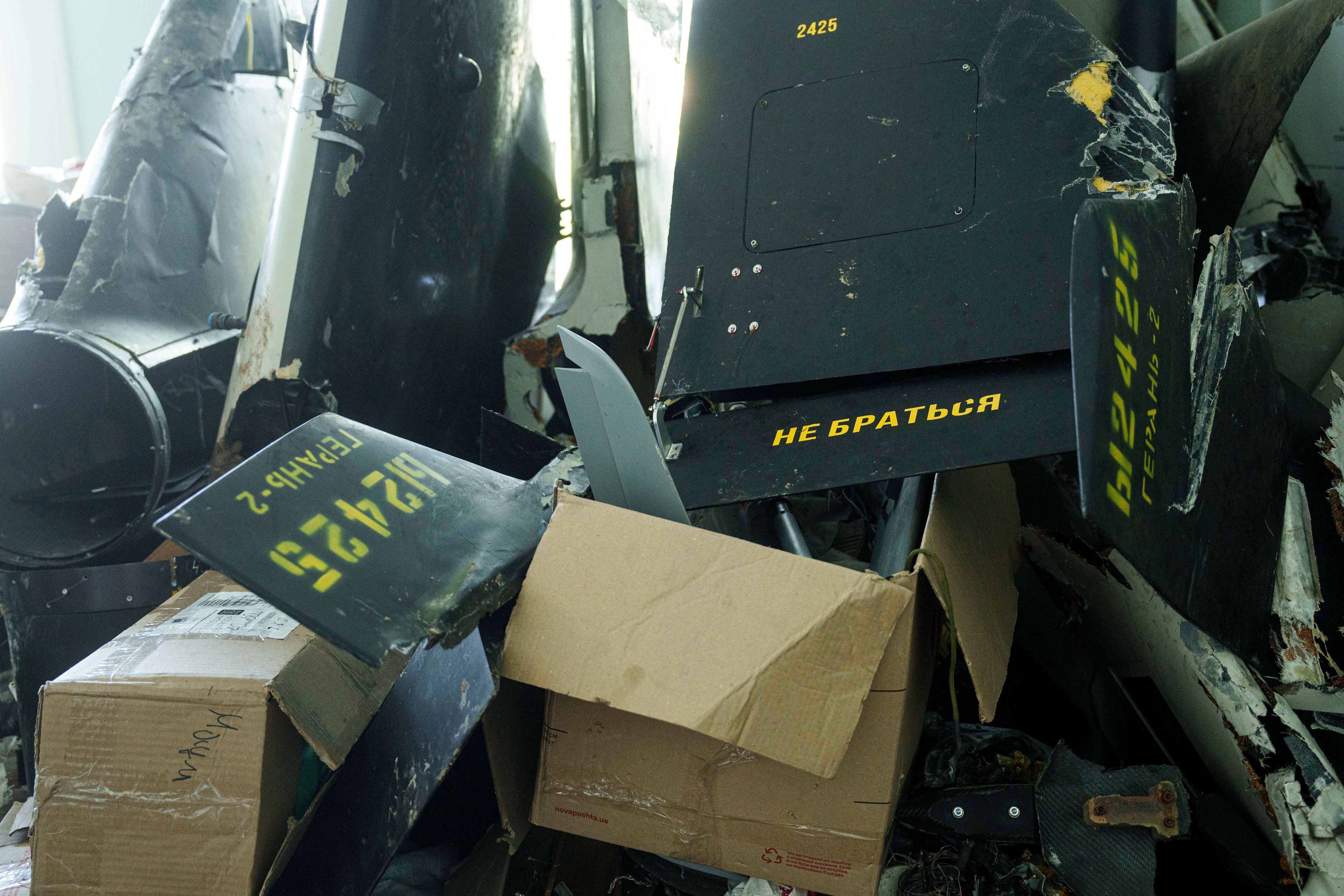 Parts of downed Shahed drones launched by Russia are piled in a storage room of a research laboratory in Kyiv, Ukraine, on Aug. 28, 2024. (AP Photo/Evgeniy Maloletka)