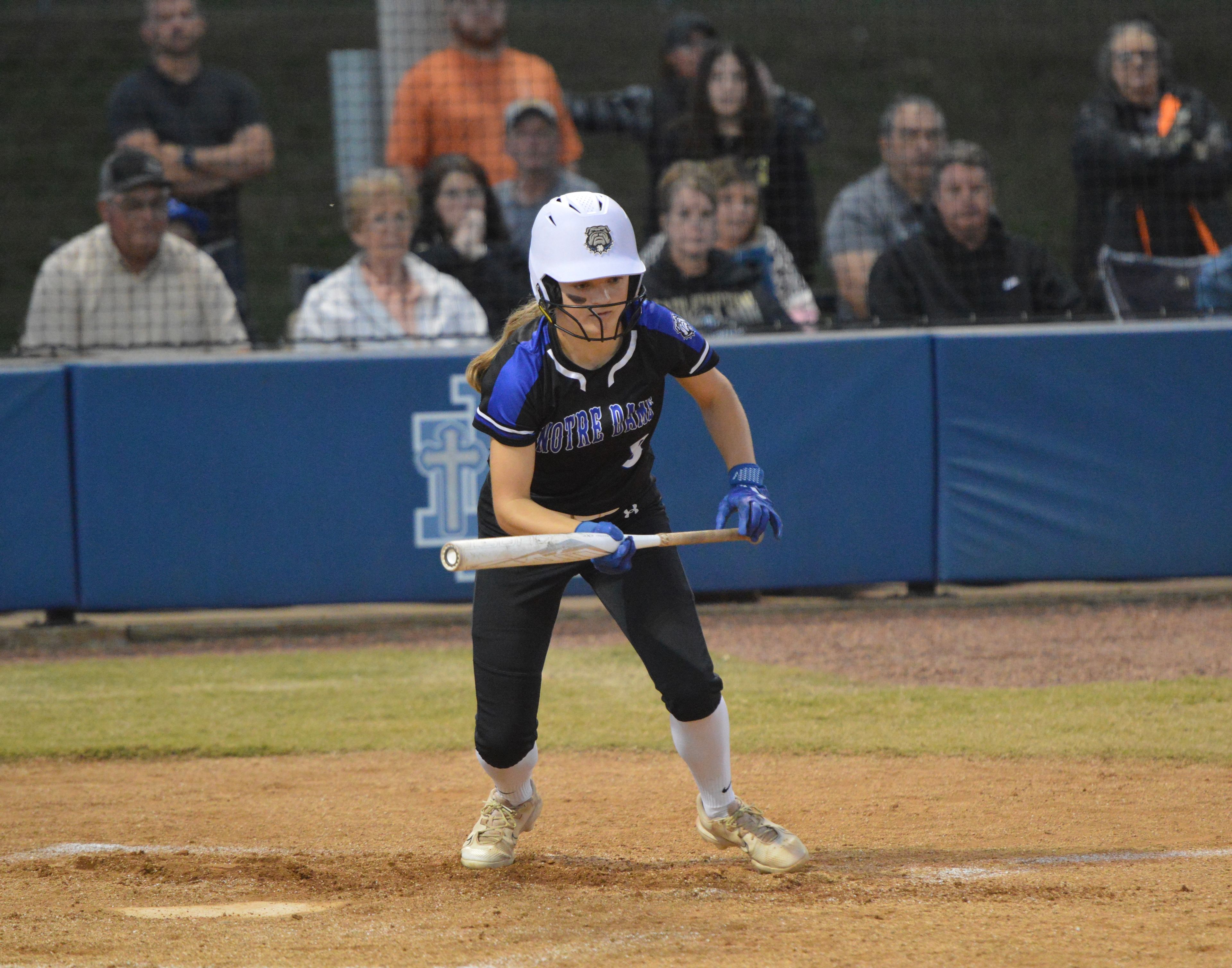 Notre Dame freshman outfielder Kaydin King bunts against Farmington in the district final on Monday, Oct. 21.