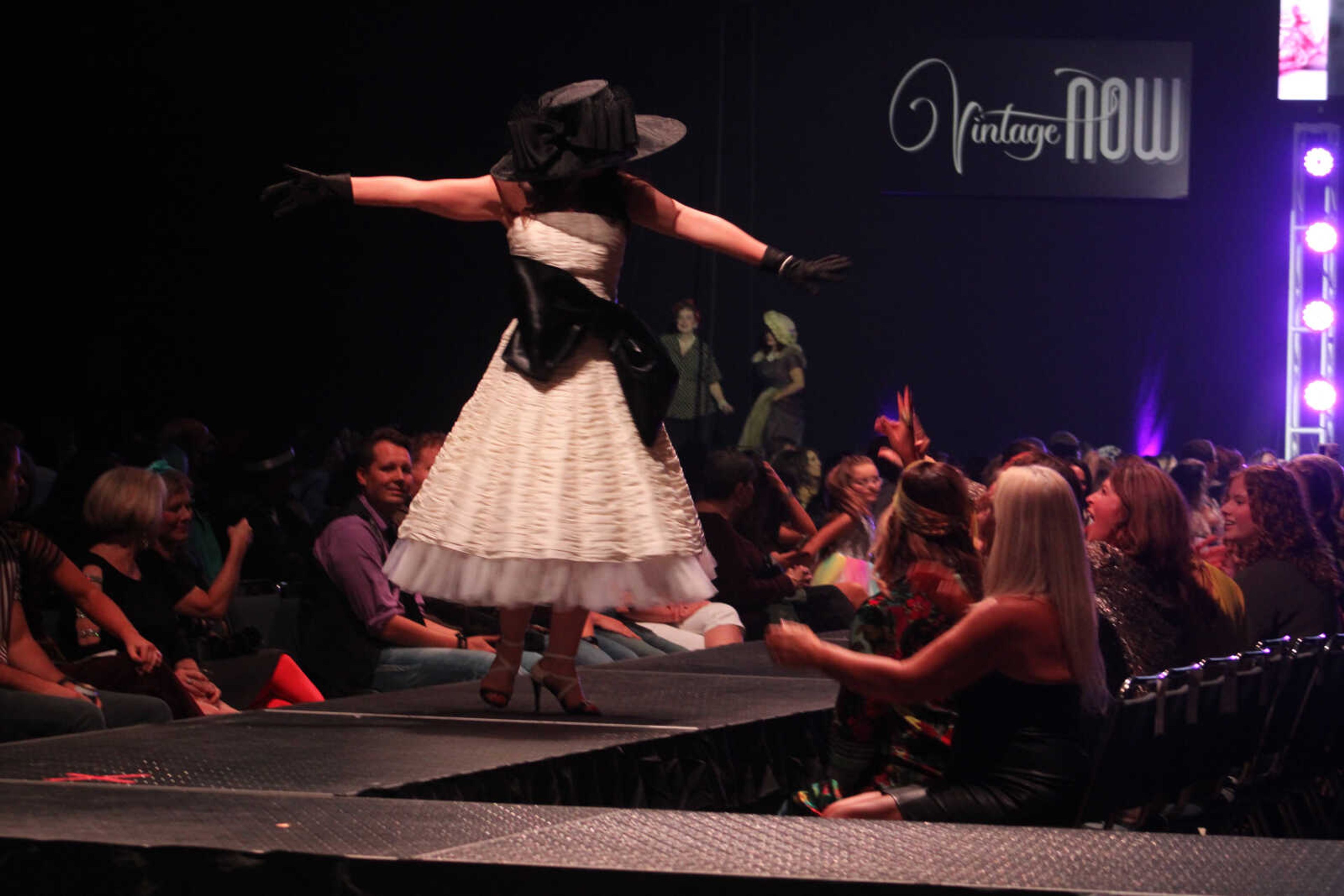 Community women perform as models and dancers in the 11th VintageNOW fashion show Saturday, Oct. 9, 2021, at the Show Me Center in Cape Girardeau.