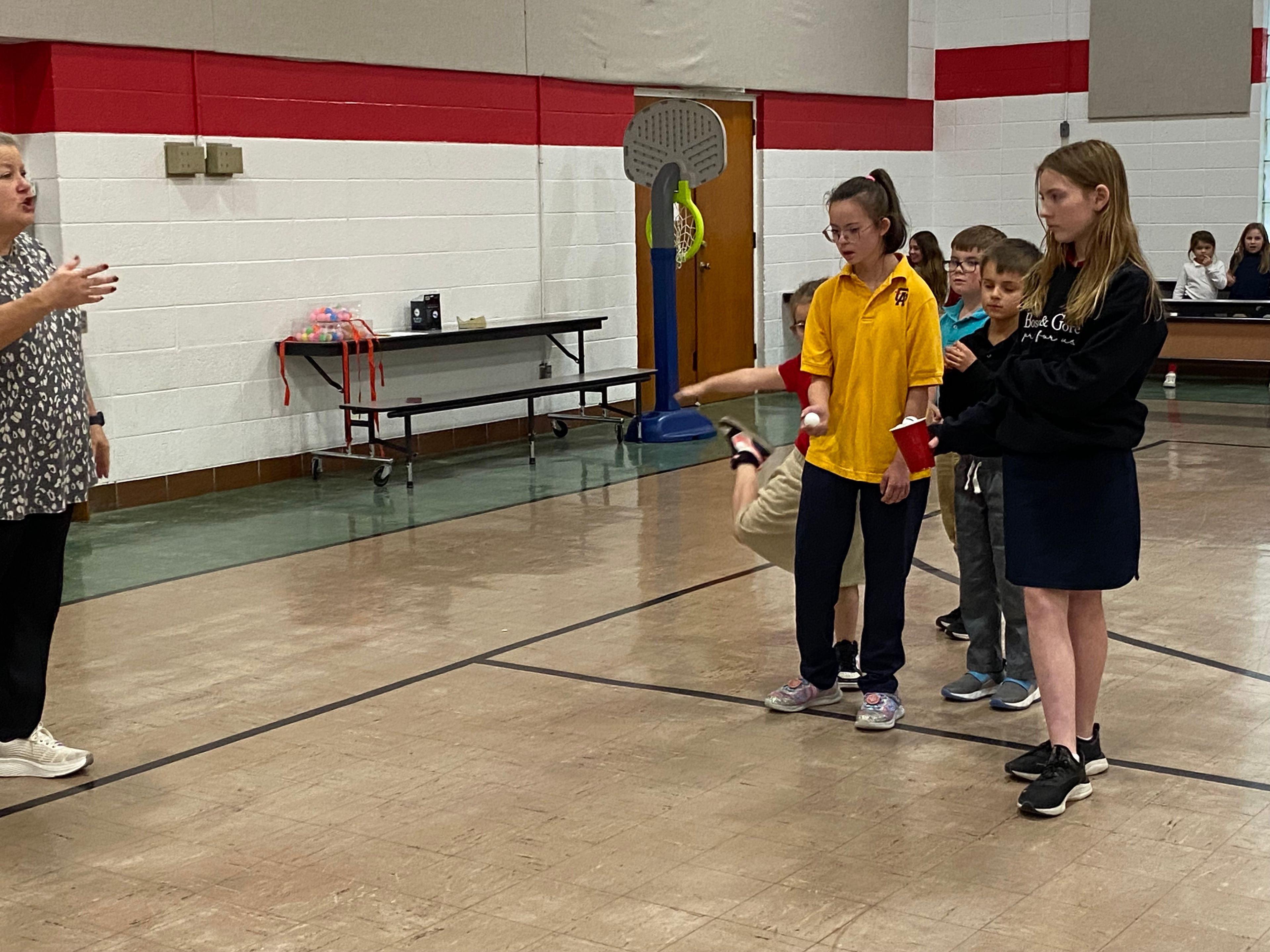 St. Gabriel's team is lined up and ready to throw a ping pong ball at the sticky bread.  Pictured are Veronica Seyer, Kase King, Brooks Curry, and Elizabeth David.
