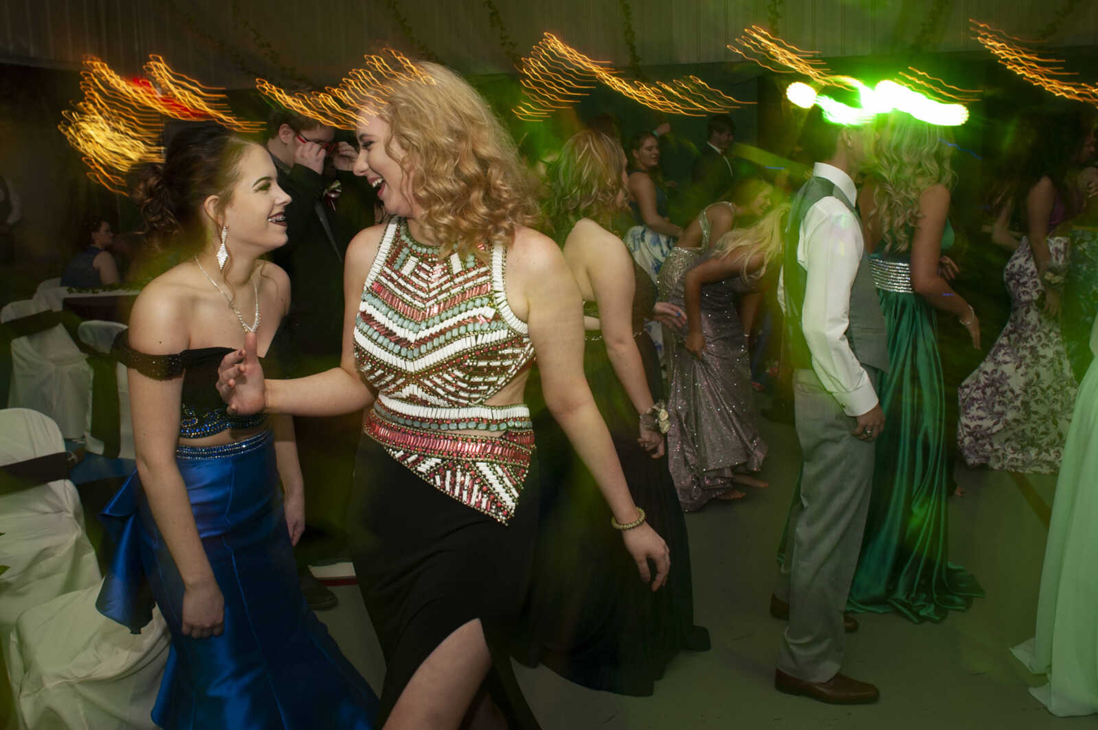 Delta sophomores Katelyn Lunsford, left, and Kourtney Ruggeri dance during Delta High School's prom on Saturday, April 13, 2019, at the Delta Community Center.