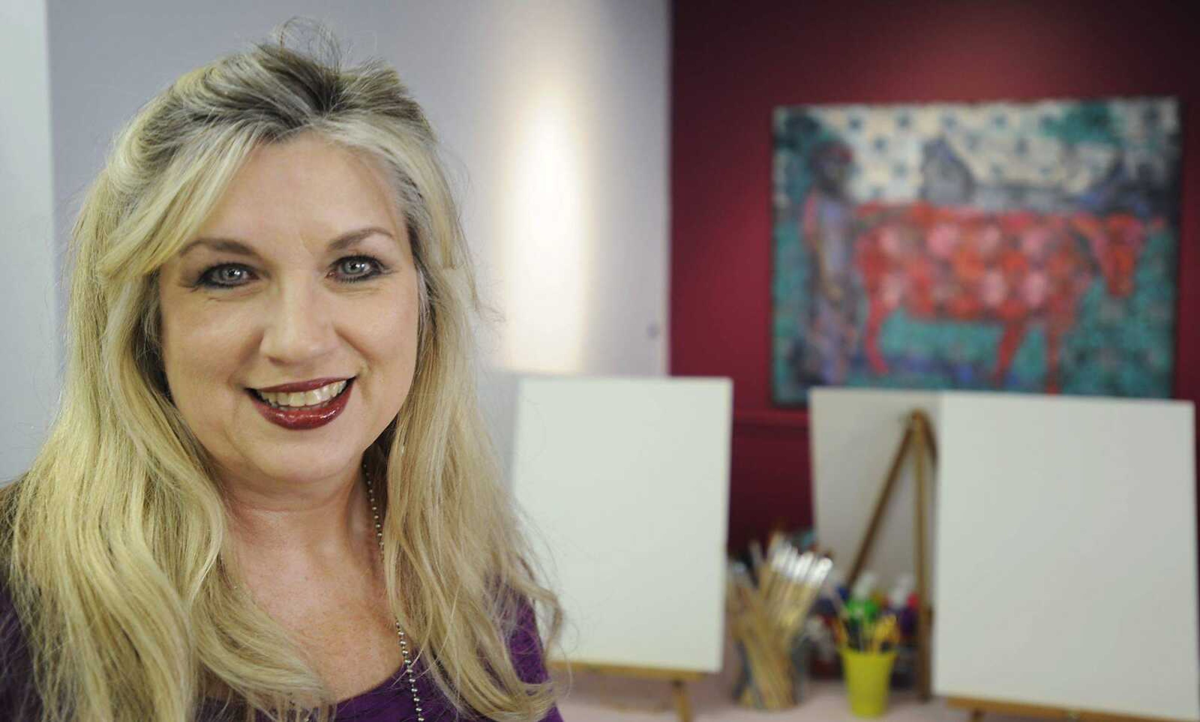 Cateye Glasses Studio owner Rosetta Whitten poses Tuesday at the studio, 401 N. Clark St. (ADAM VOGLER)