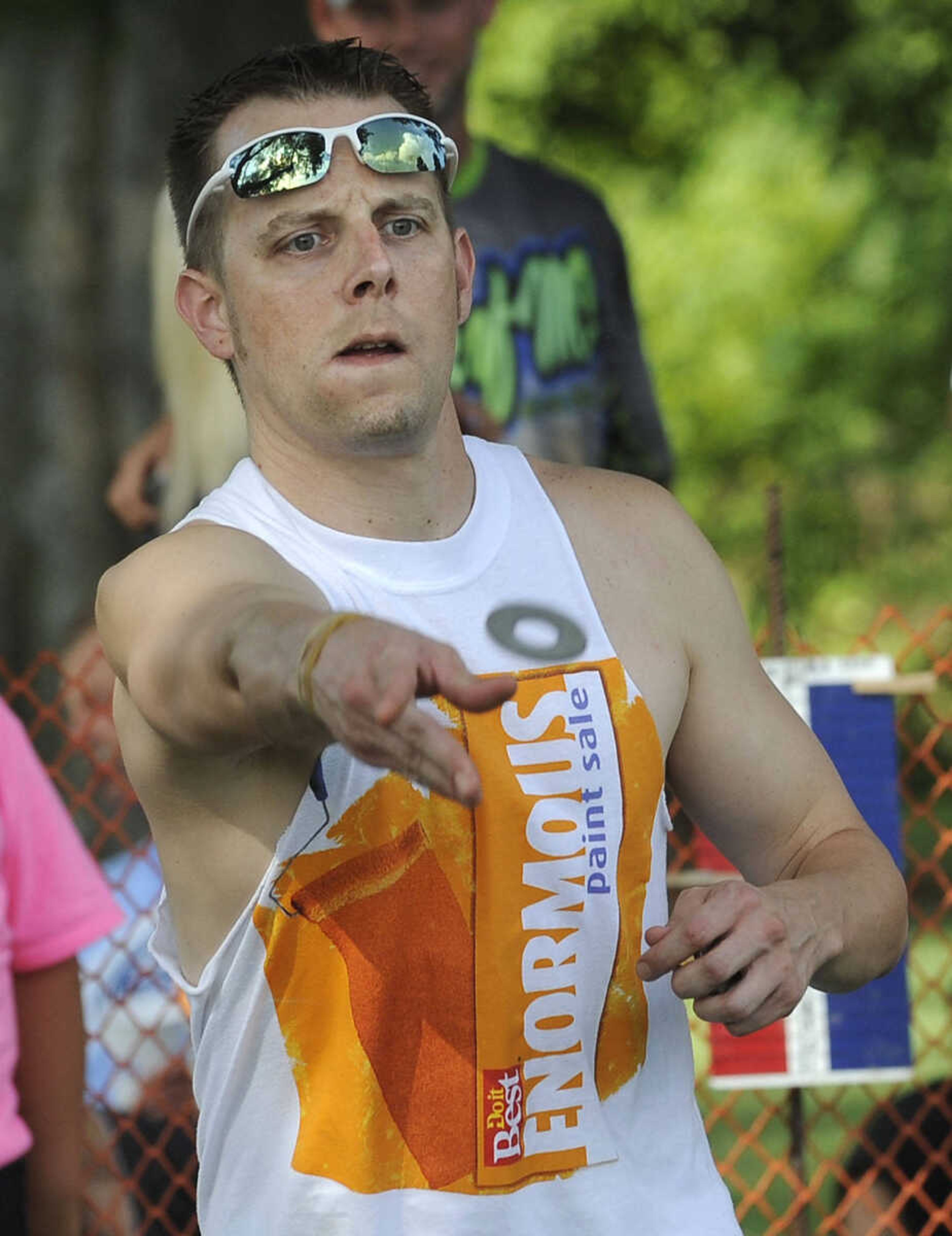 FRED LYNCH ~ flynch@semissourian.com
Andrew Horrell participates in a washers tournament at the Chaffee German Days on Saturday, Aug. 9, 2014 at Frisco Park in Chaffee, Missouri.