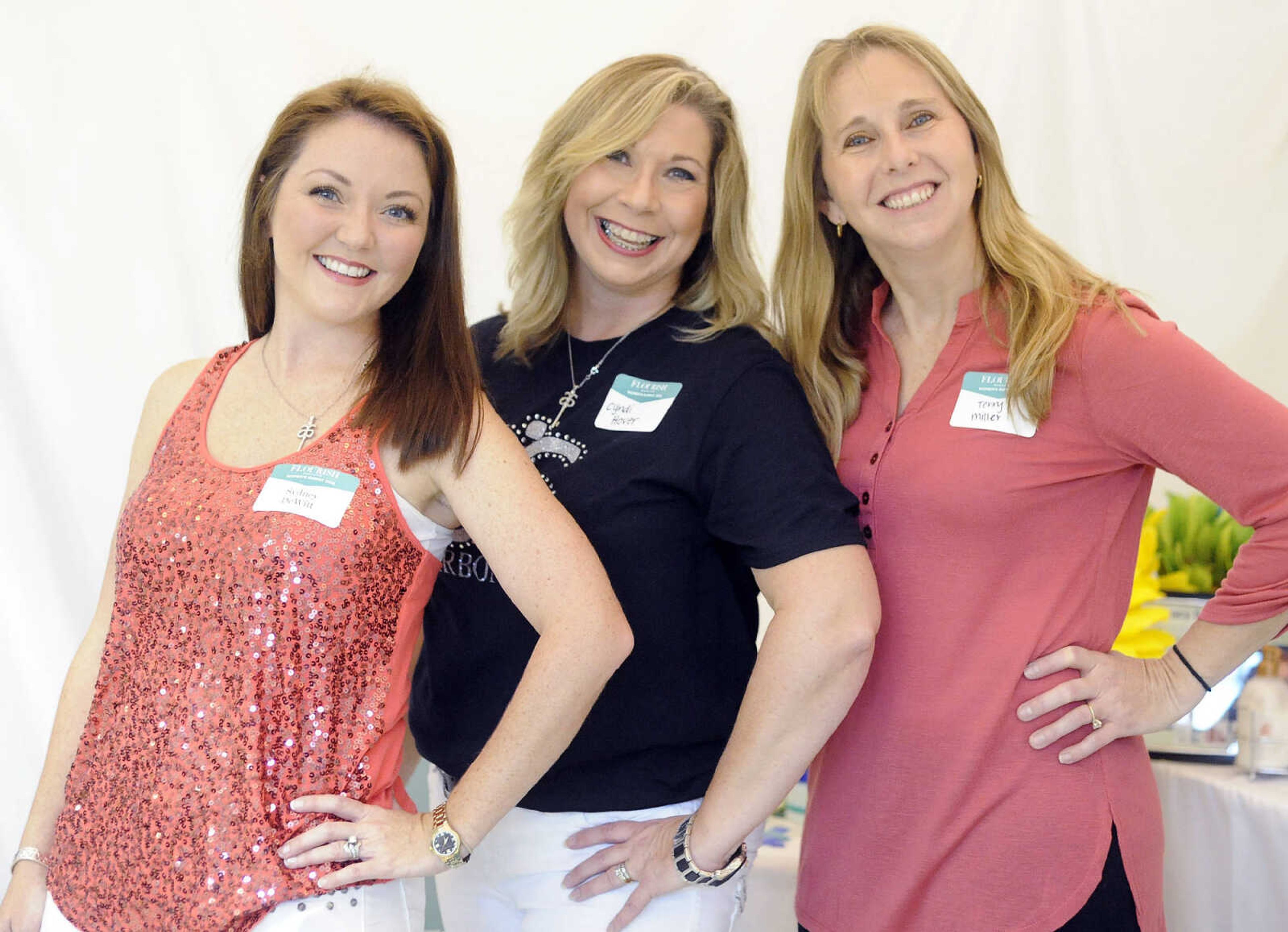 LAURA SIMON ~ lsimon@semissourian.com

Sydney DeWitt, left, Cyndi Hover, center, and Terry Miller pose for a photo during the Flourish Women's Summit on Thursday, Aug. 25, 2016, at the Osage Centre in Cape Girardeau.