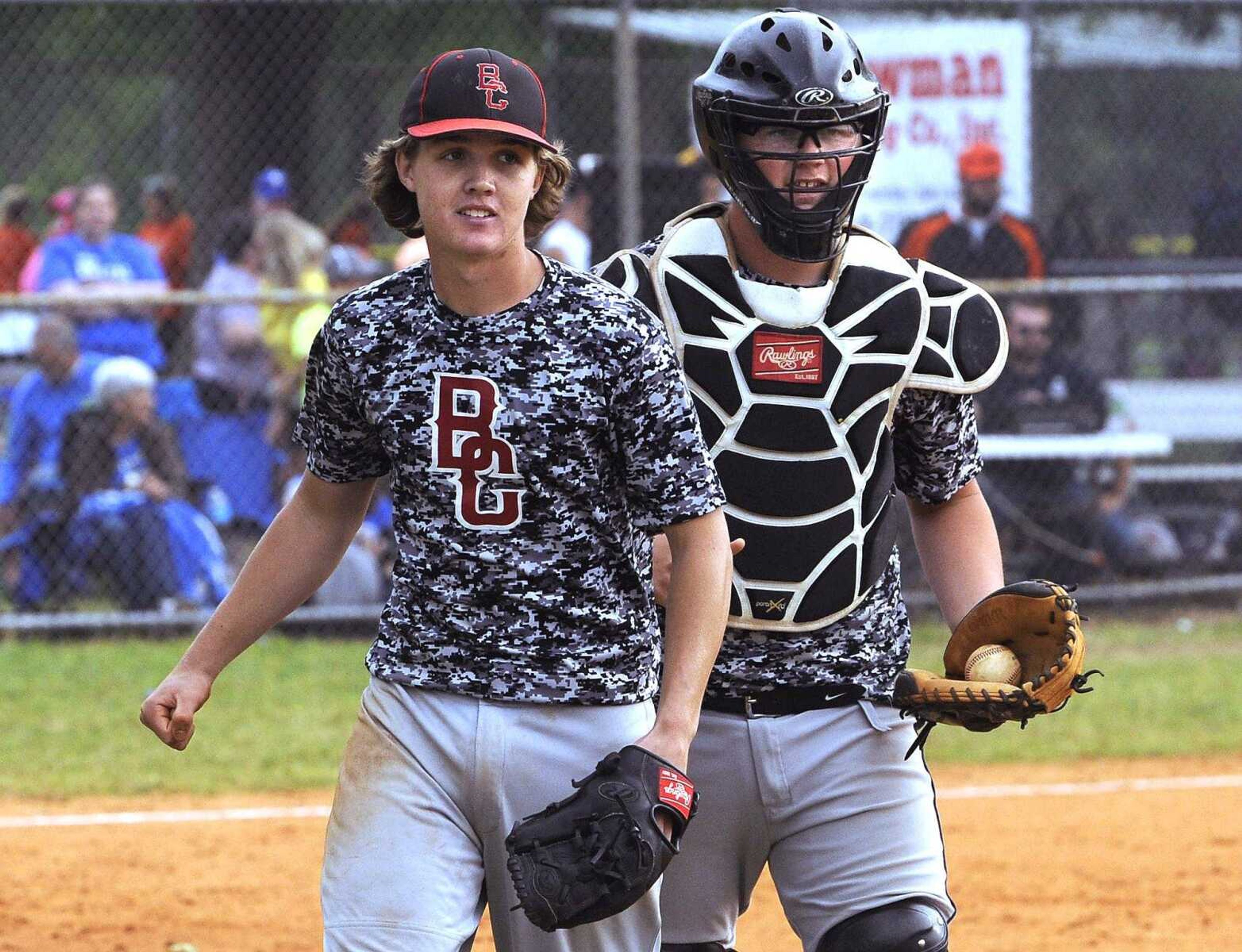 Bell City pitcher Austin Hicks and catcher Bobby Wright react to their 4-1 win over Oran in the Class 1 District 2 championship game Thursday, May 19, 2016 in Advance, Missouri.