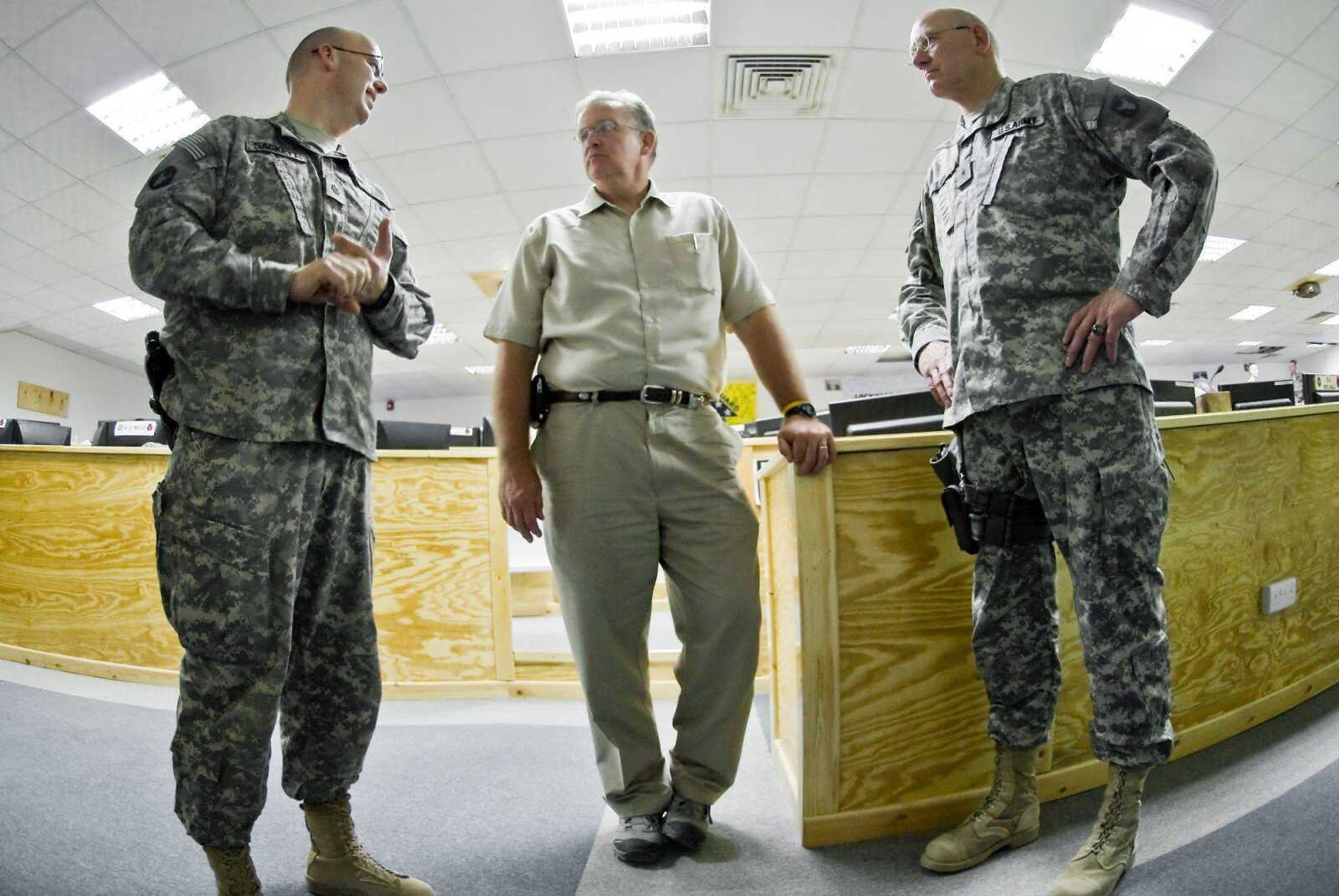 Spc. Tyler Maulding ~ U.S. Army<br>Missouri Gov. Jay Nixon is guided through a tour of the operations center of Multi-National Division-South headquarters by Brig. Gen.<br>Gerald Lang, right, and Lt. Col. Chad Sackett, left. Nixon came to COB Basra as part of a tour that included Nevada Gov. Jim Gibbons and Minnesota Gov. Tim Pawlenty.