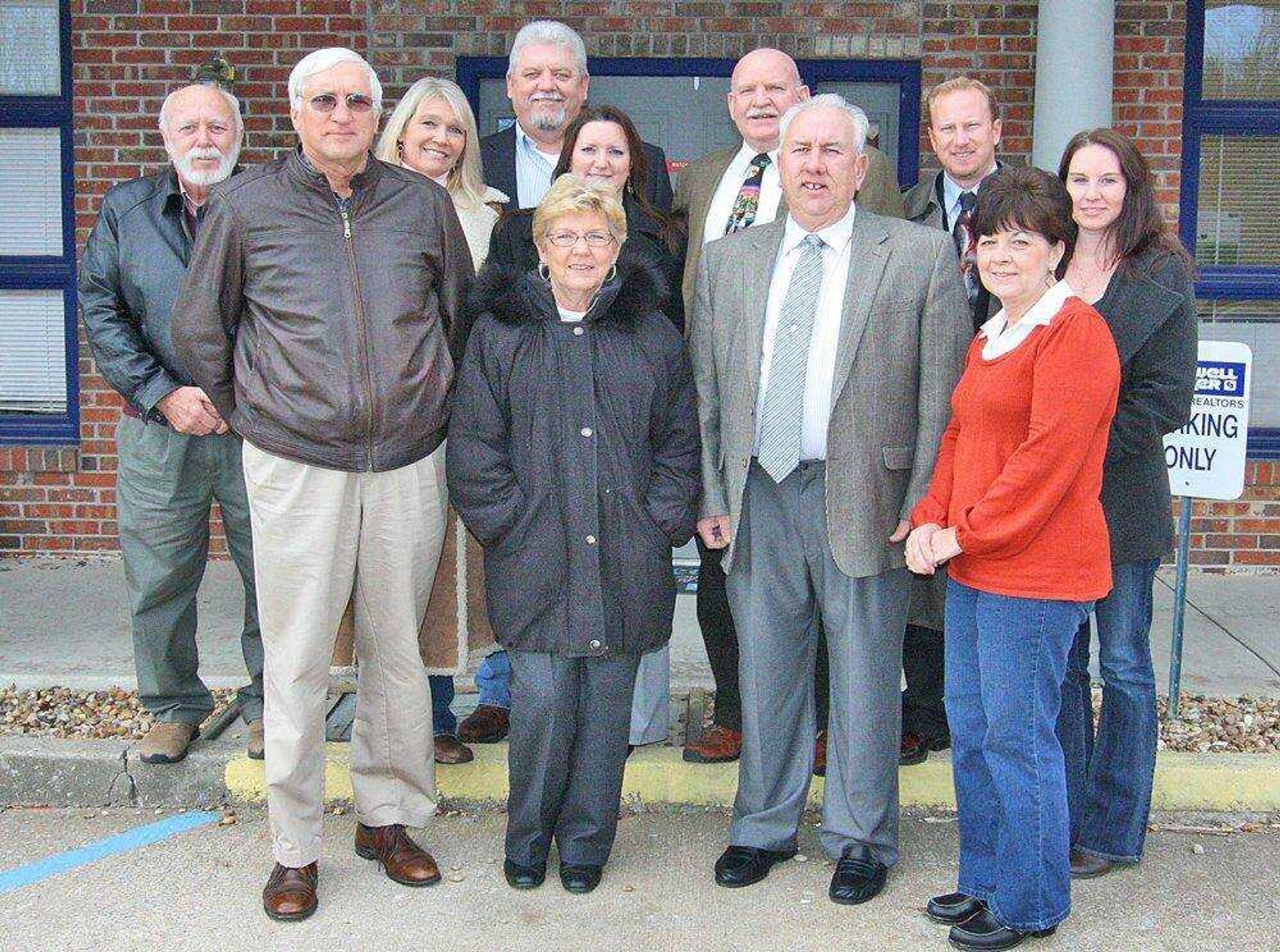 Coldwell Banker Select changes hands - pictured are Ken Ruth, Harriet Drusch, Gary Turner, Shelba Turner George Callis, Paula Mayfield, Ken King, Shari McConnell, Ken Inman, Chris Mathes and Jennifer Dunn. (submitted photo)