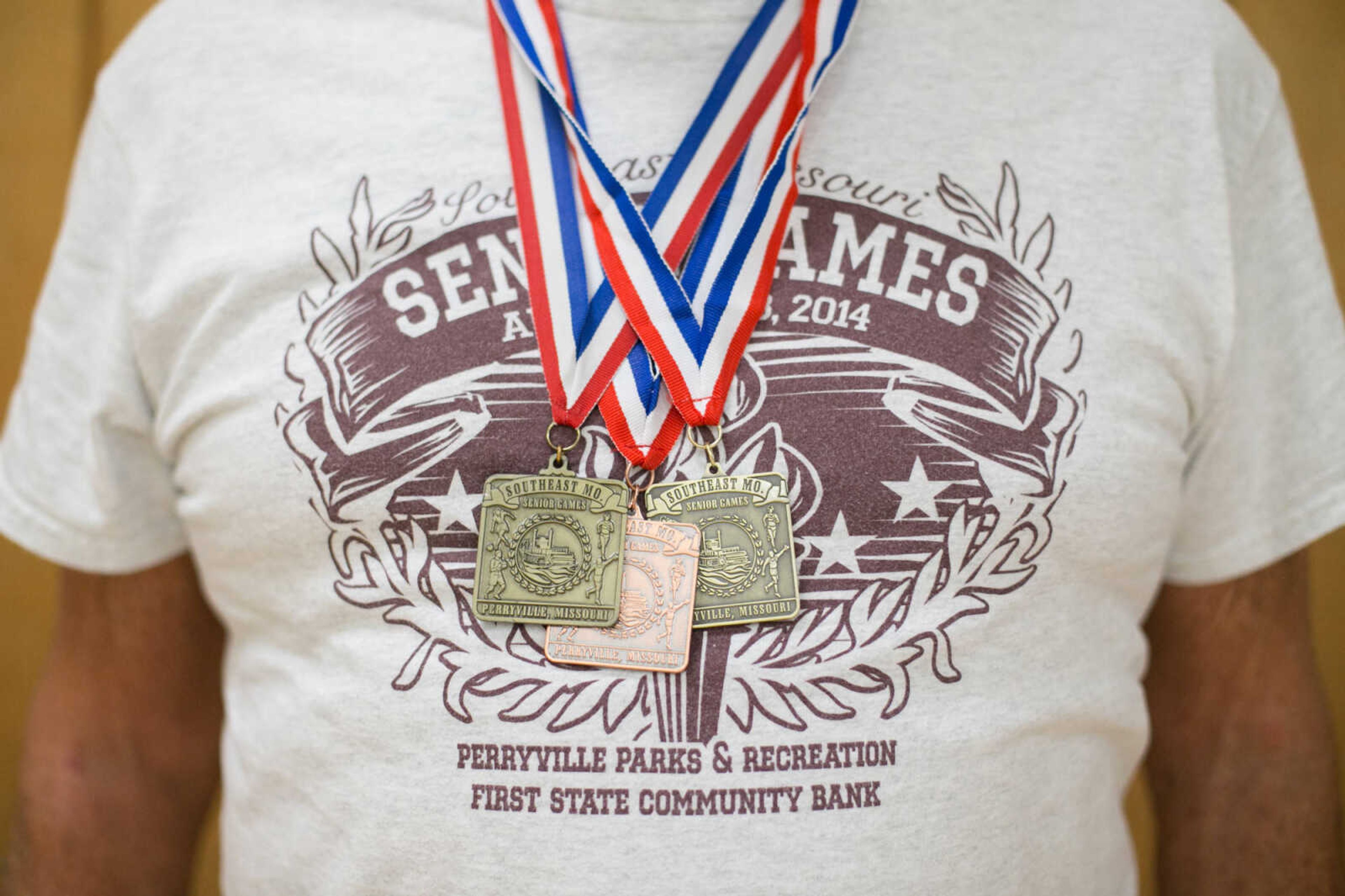 GLENN LANDBERG ~ glandberg@semissourian.com

Bill Cannon, 84, displays his hardware after the awards ceremony during the first day of the Southeast Missouri Senior Games in Perryville, Missouri Wednesday, Aug. 19, 2015.