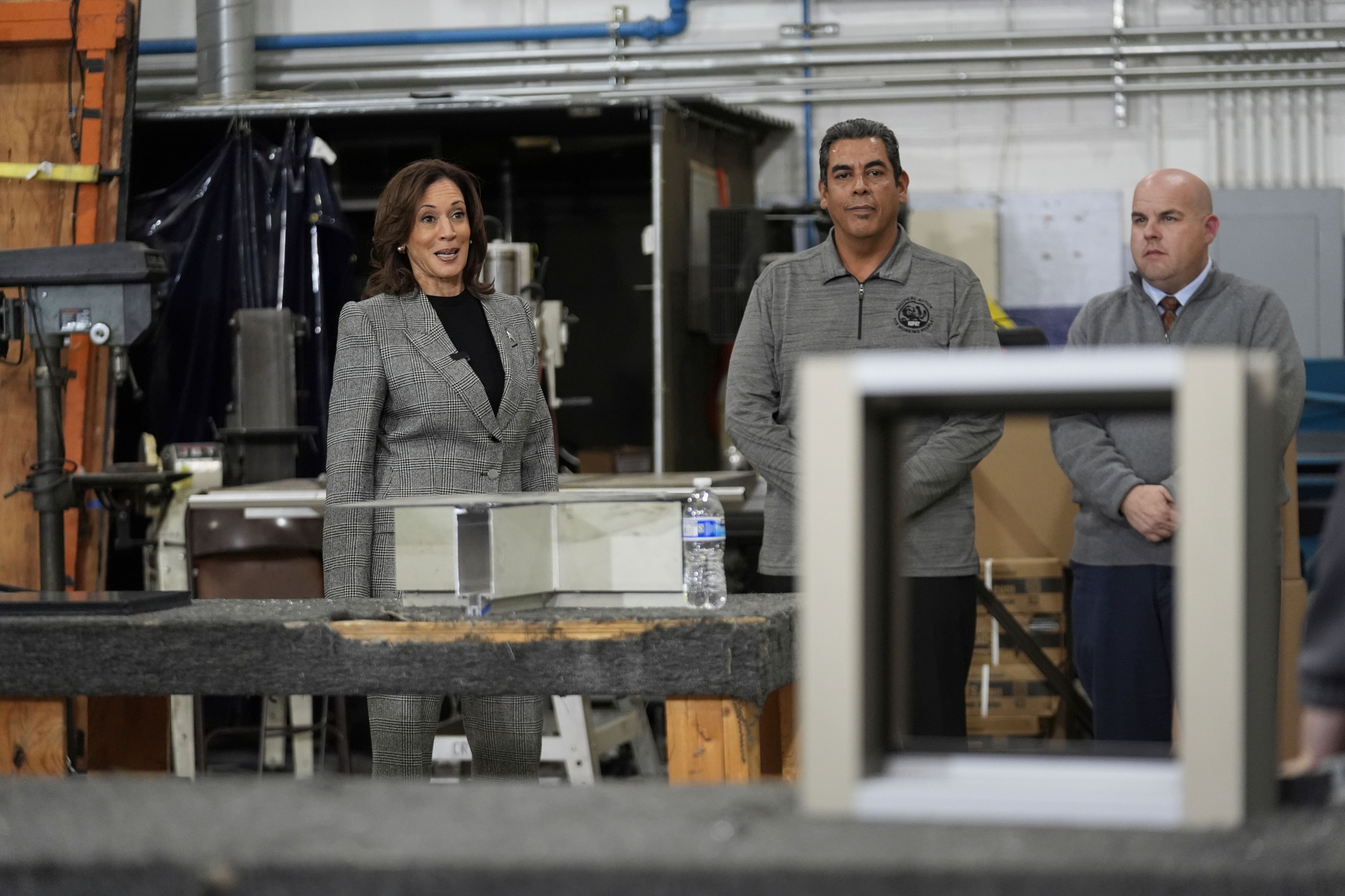 Democratic presidential nominee Vice President Kamala Harris tours the International Union of Painters and Allied Trades District Council 1M facilities, Monday, Oct. 28, 2024, in Warren, Mich. (AP Photo/Paul Sancya)