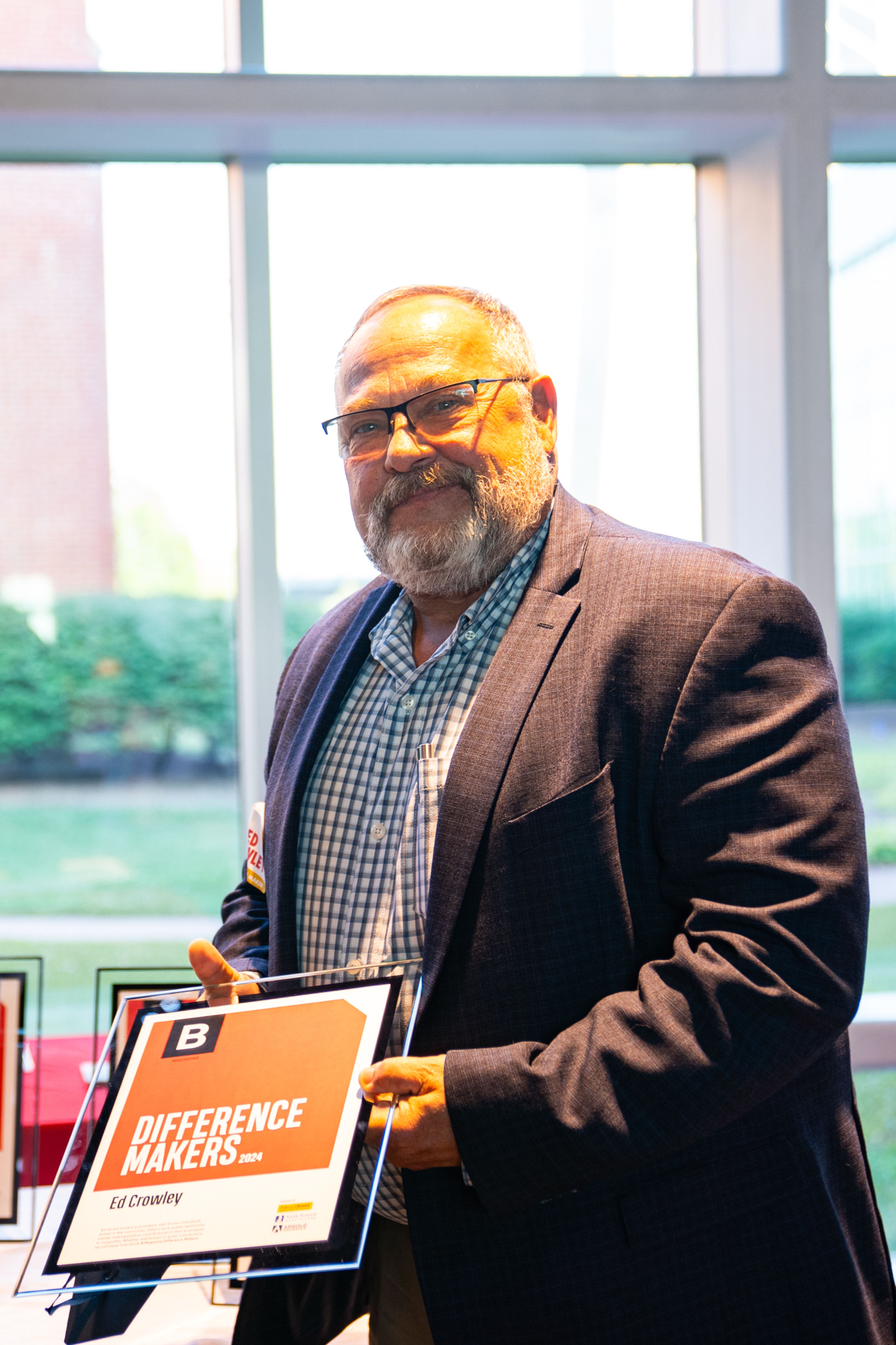 Ed Crowley receives a plaque recognizing him as a 2024 Difference Maker at their reception at Southeast Missouri State University’s River Campus. The Difference Maker’s reception was presented by B Magazine on Thursday, Sept. 6.