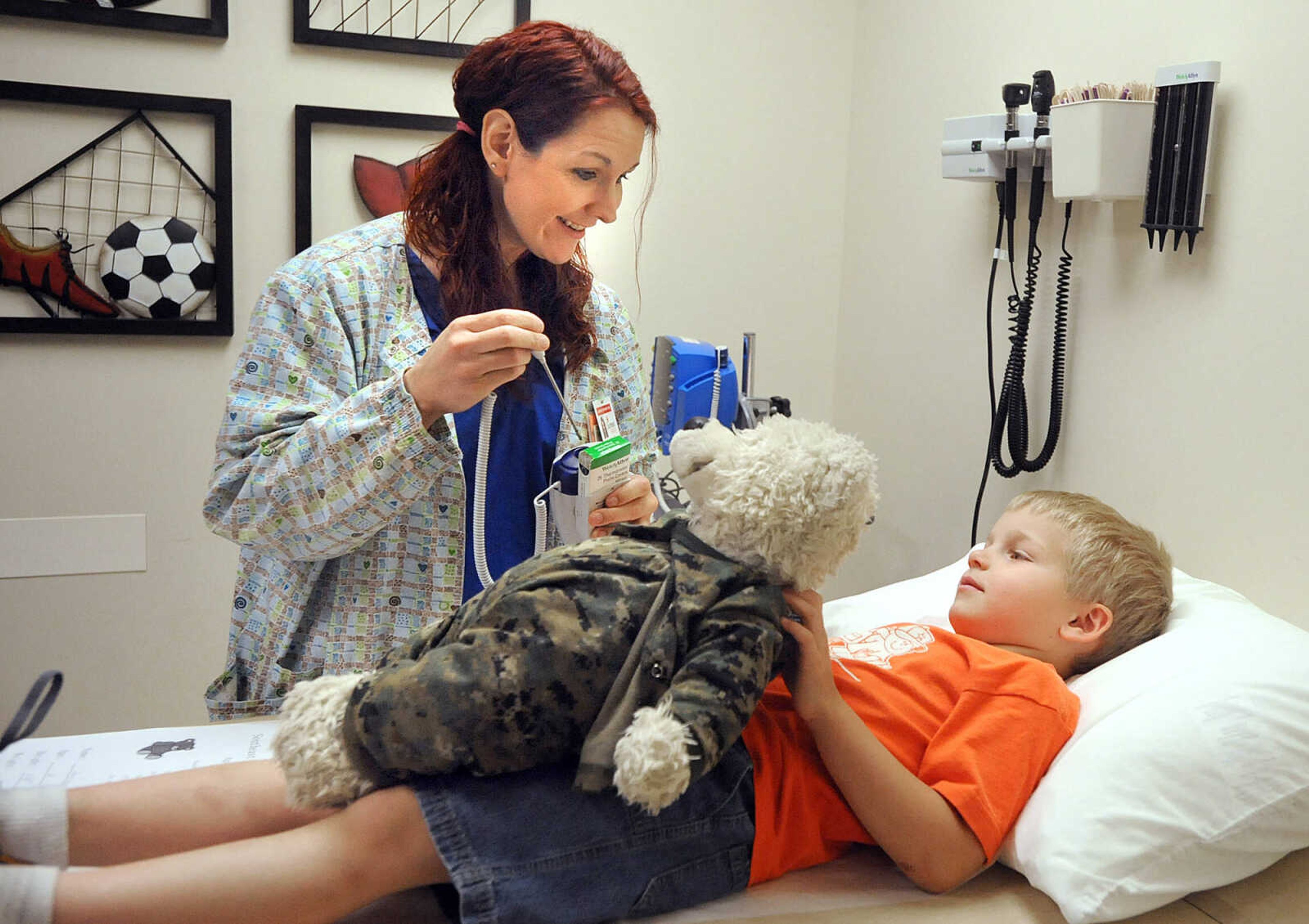 LAURA SIMON ~ lsimon@semissourian.com

Graham Hassheider lays down on the exam table while Snowy gets his temperature taken by Rebecca McClanahand Tuesday morning, April 30, 2013 at SoutheastHEALTH Primary Care in Cape Girardeau. Big Stuff preschool students got to bring their stuffed animals, ranging from teddy bears to tigers, in for exams Tuesday.