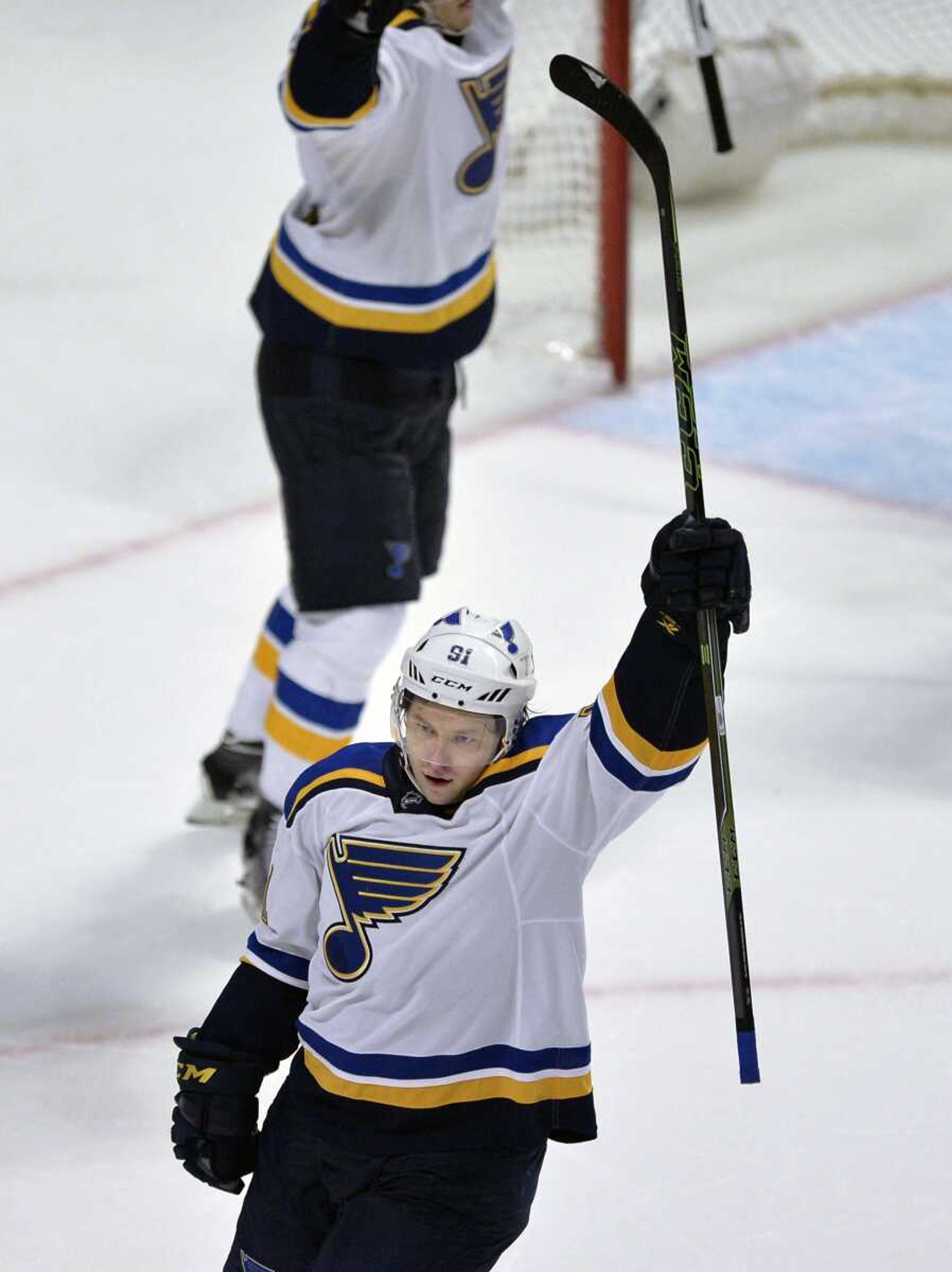 The Blues' Vladimir Tarasenko celebrates after scoring the winning goal to defeat the Blackhawks 6-5 during overtime Wednesday in Chicago. (Paul Beaty ~ Associated Press)