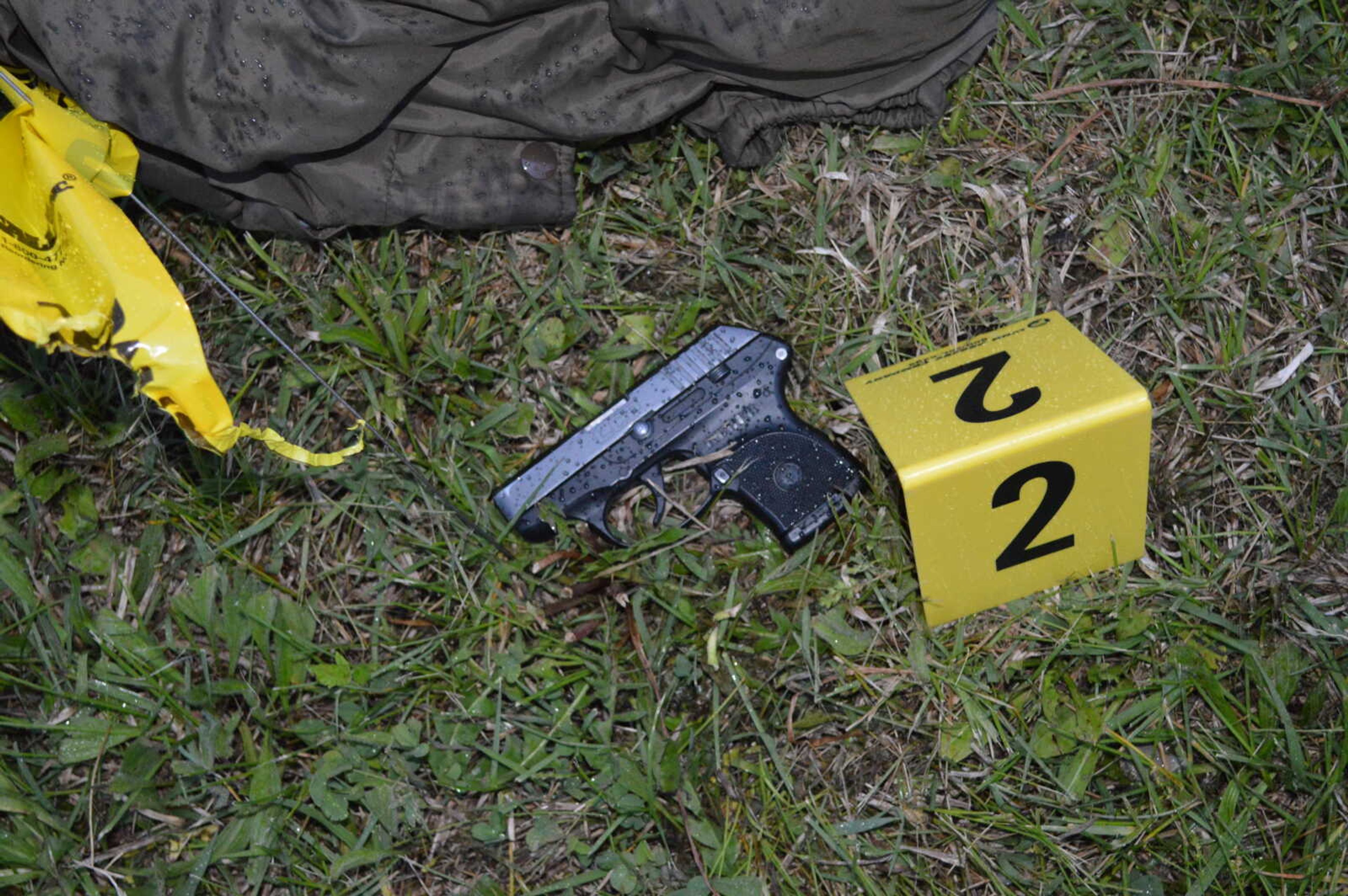 A close up of Jason McBride's backup Ruger handgun, which was previously secured around his ankle and was found alongside the tire marks left in the grass, according to police evidence.