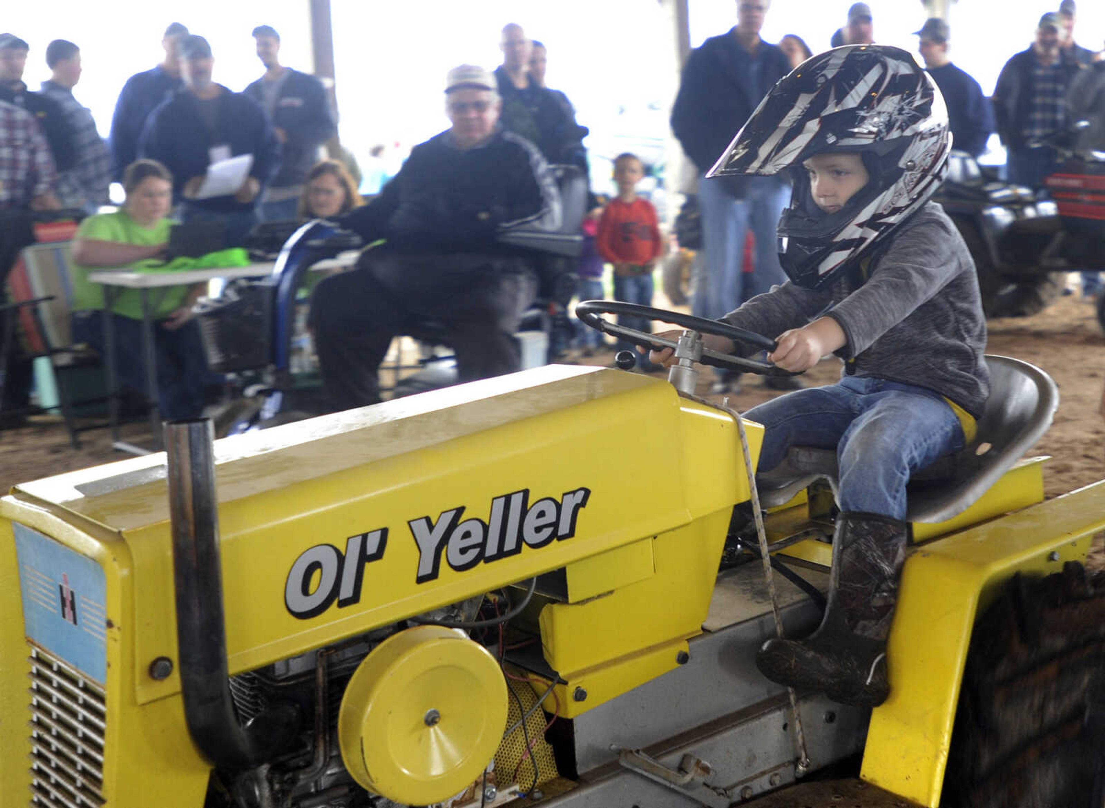 Luke Schlenker competes in the lawn and garden tractor pull at the Cousin Carl Farm Show on Saturday, March 12, 2016 at Arena Park.