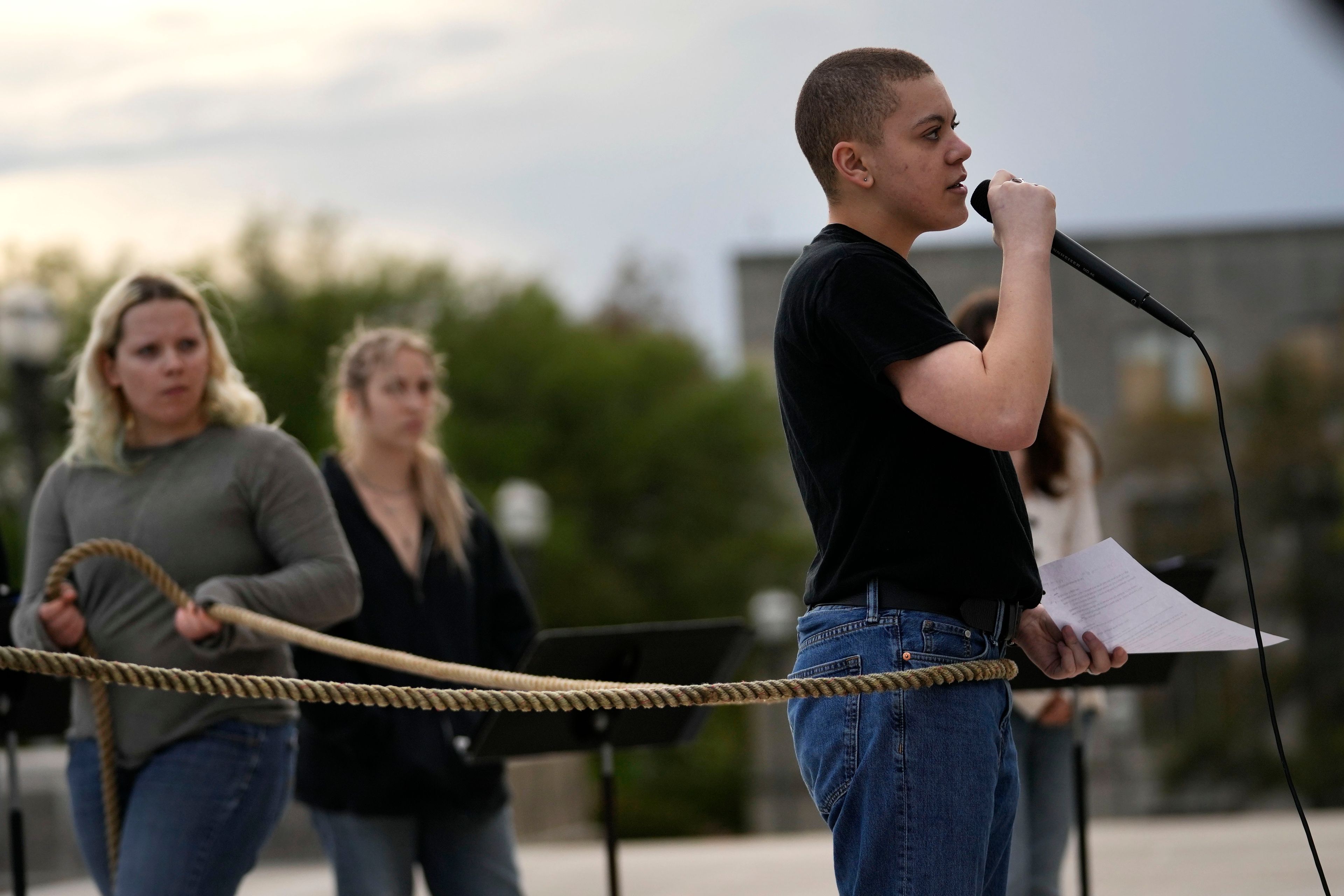 FILE - Jude Armstrong and fellow Benjamin Franklin High playwriting class students perform their play, "The Capitol Project," on the steps of the Louisiana Capitol in Baton Rouge, La., March 27, 2024. (AP Photo/Gerald Herbert, File)