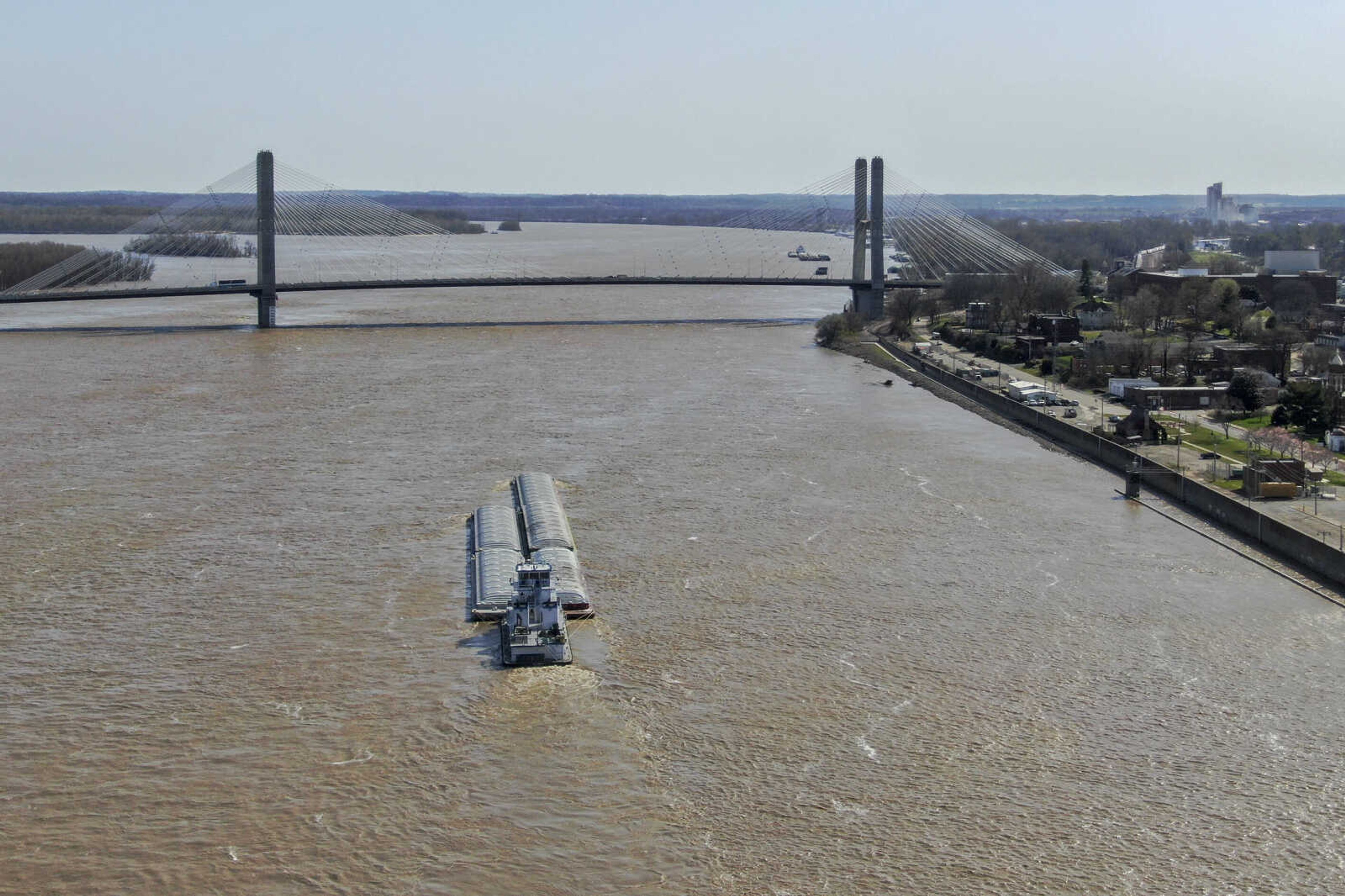 A barge approaches the Bill Emerson Memorial Bridge on the Mississippi River in Cape Girardeau on Wednesday, March 24, 2021. 