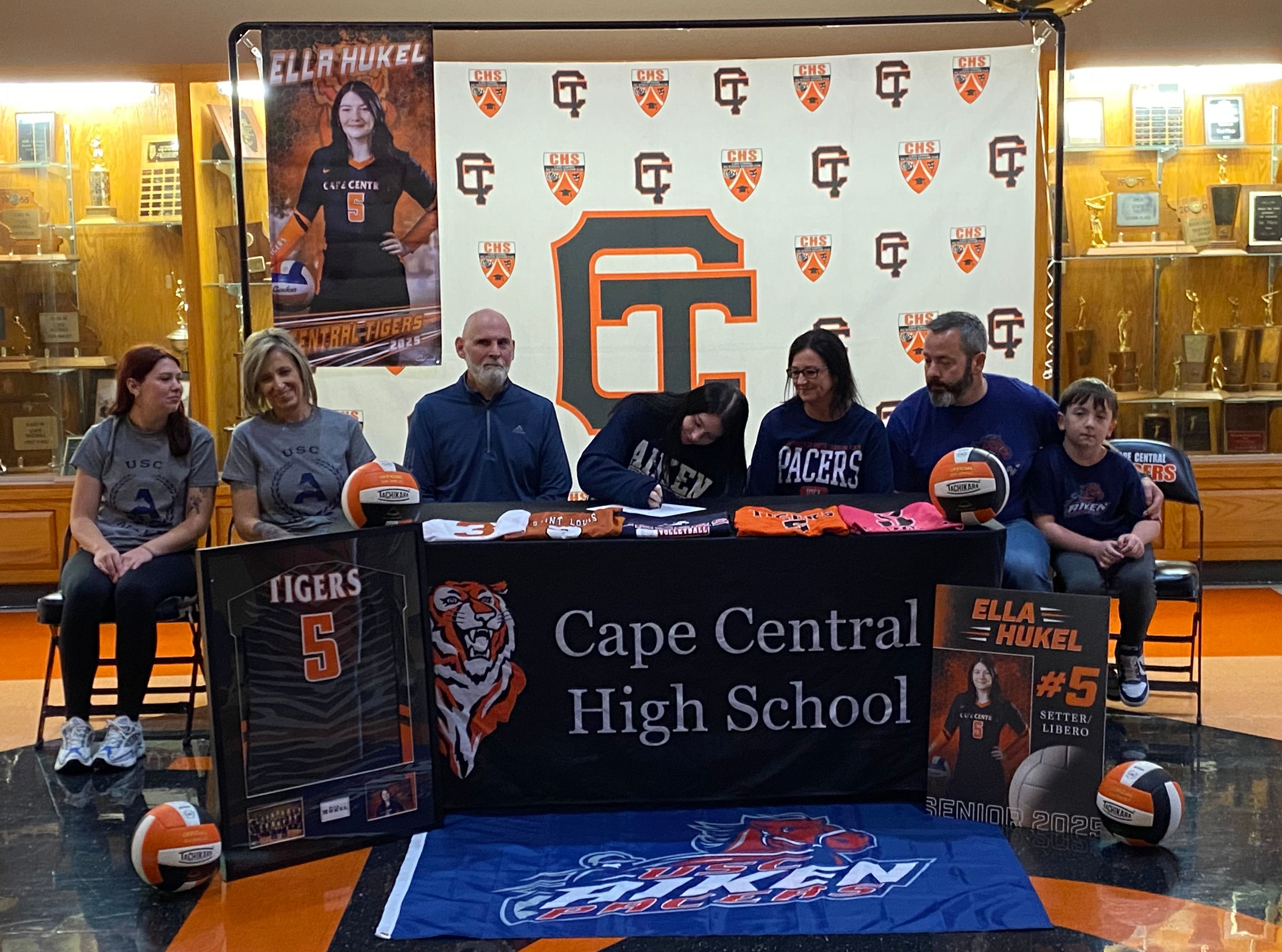 Cape Central volleyball senior Ella Hukel signs her national letter of intent to the University of South Carolina Aiken alongside her family on Monday, Dec. 2, at Cape Central High School.