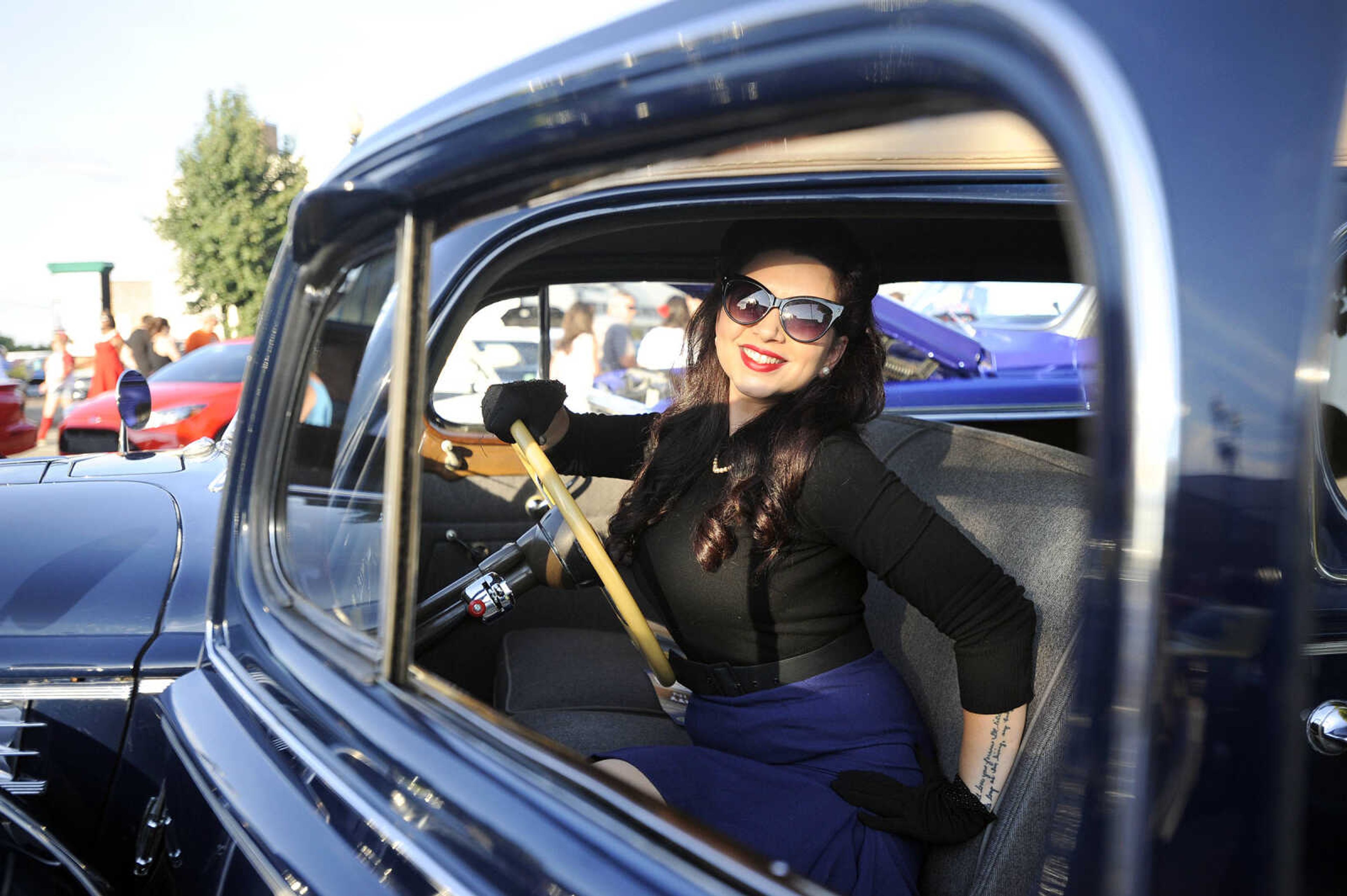 LAURA SIMON ~ lsimon@semissourian.com

Jona Edwards poses with a 1940 Packard 180 during the Perryville Pin-Up contest on Saturday, Sept 3, 2016, in Perryville, Missouri.