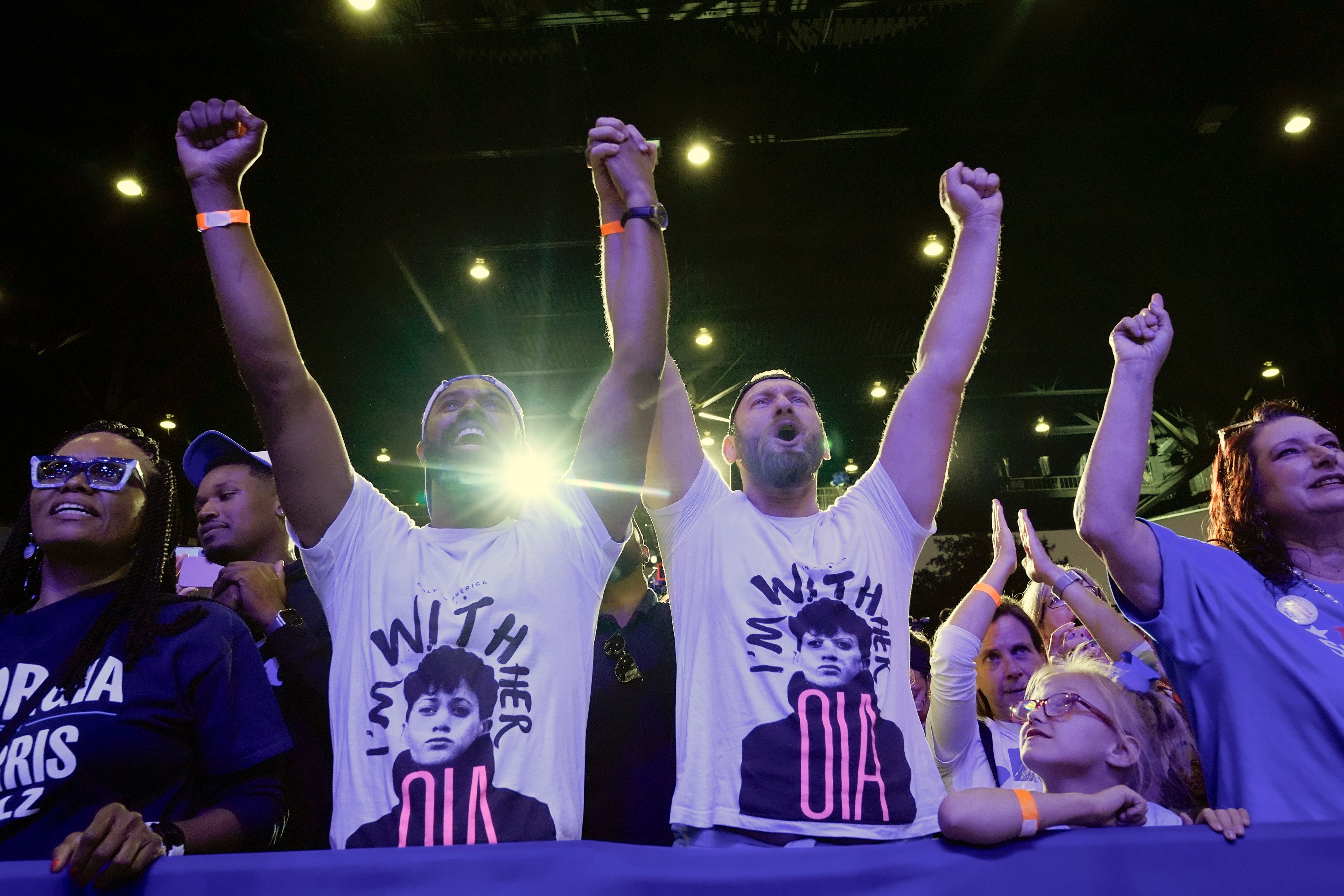 A couple cheers at the end of Democratic presidential nominee Vice President Kamala Harris' speech during a campaign event at Lakewood Amphitheatre, Saturday, Oct. 19, 2024, in Atlanta. (AP Photo/Jacquelyn Martin)