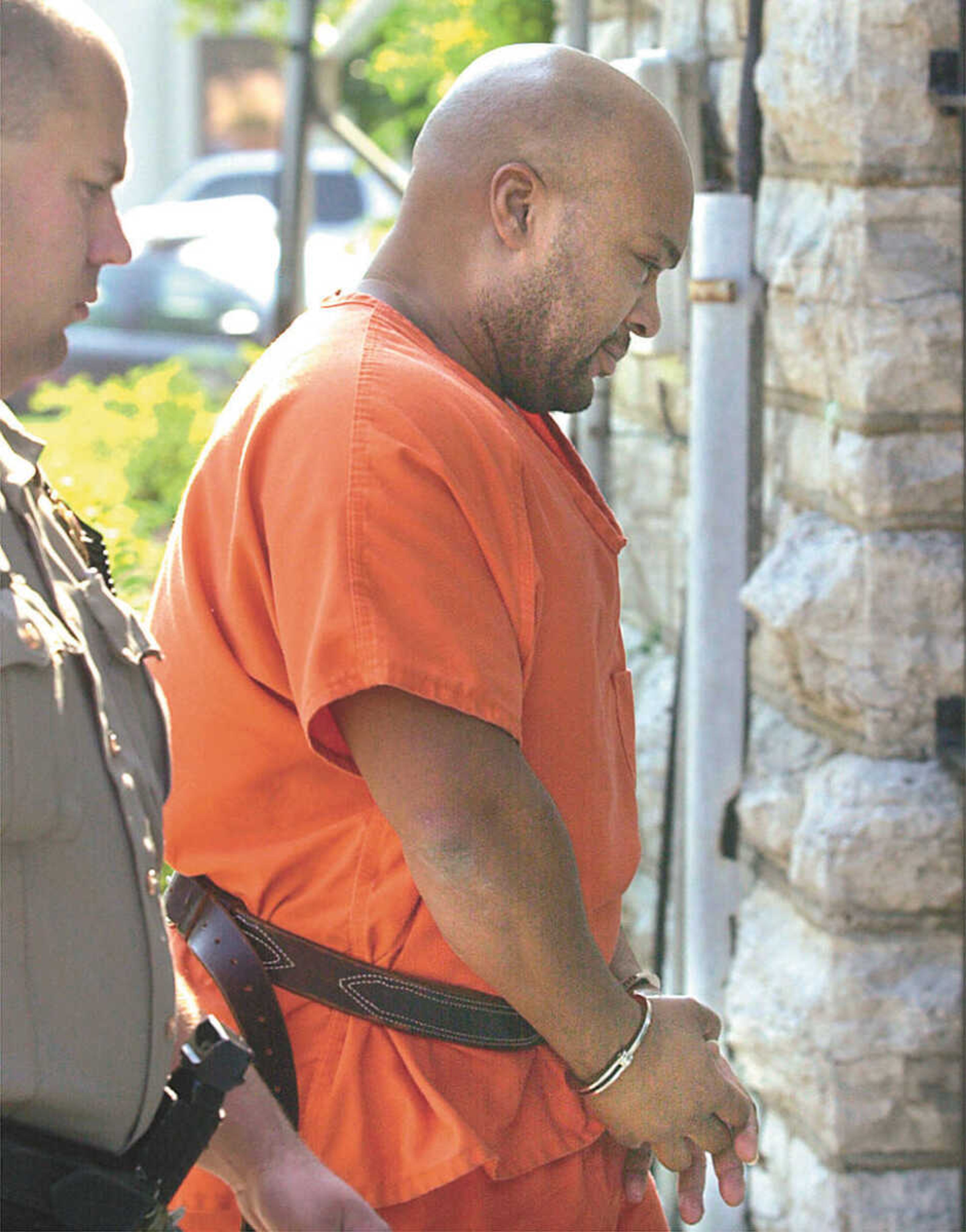 Southeast Missourian/Fred Lynch
Mark Gill was escorted into the Cape Girardeau County Courthouse in this file photo. Gill was convicted in 2004 of the murder of Ralph Lape.