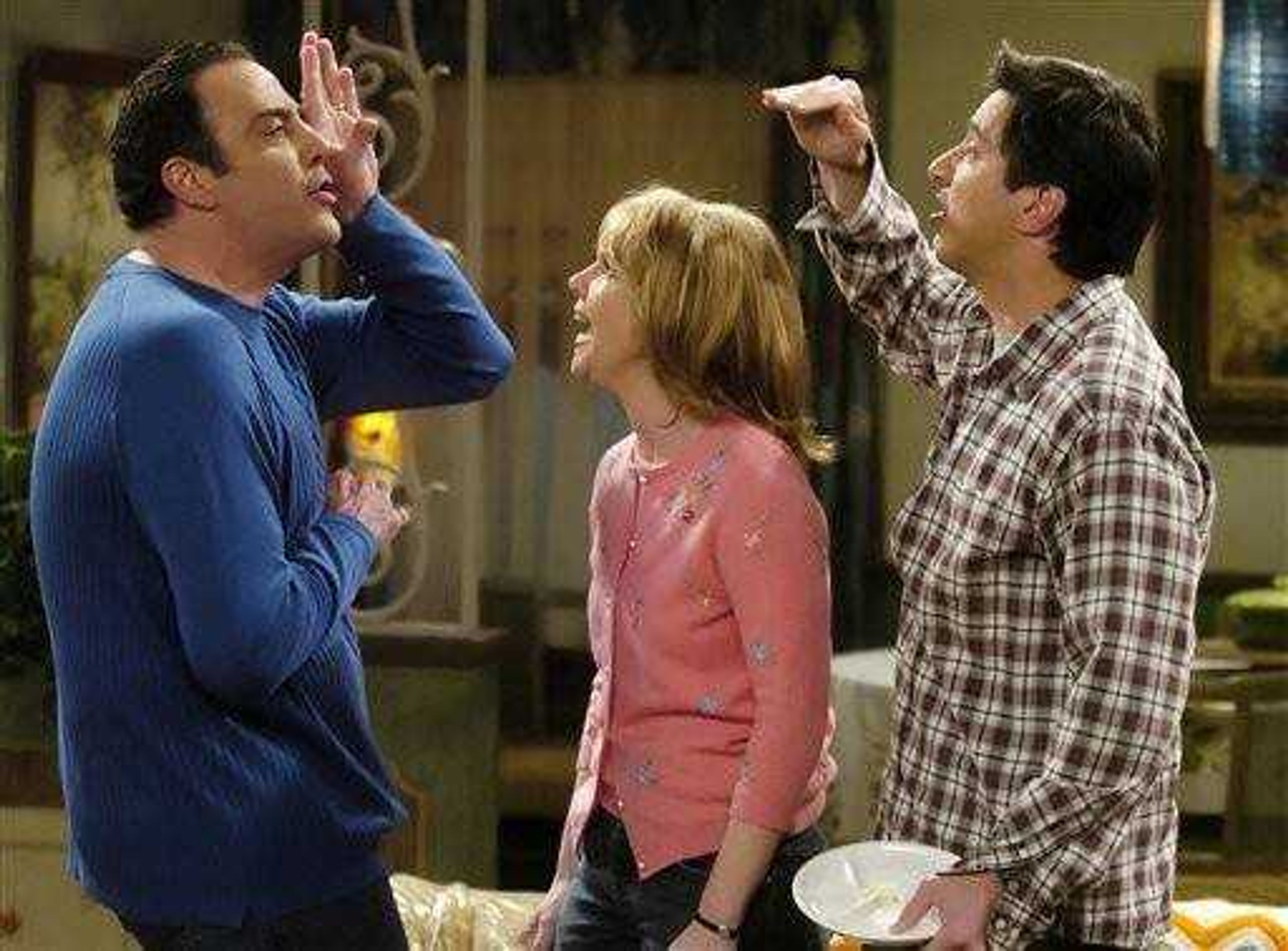 "Everybody Loves Raymond" cast members, from left, Brad Garrett, Monica Horan and Ray Romano perform during a taping of one of the final episodes of the show at Warner Bros. Studios in Burbank, Calif.